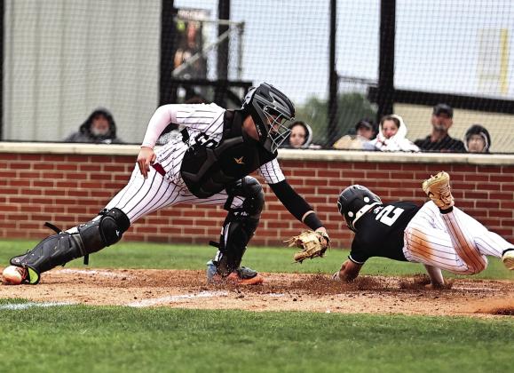North Rock Creek’s Braden Ueltzen tags the Perkins runner out at home. Photo courtesy of Gowin Photography