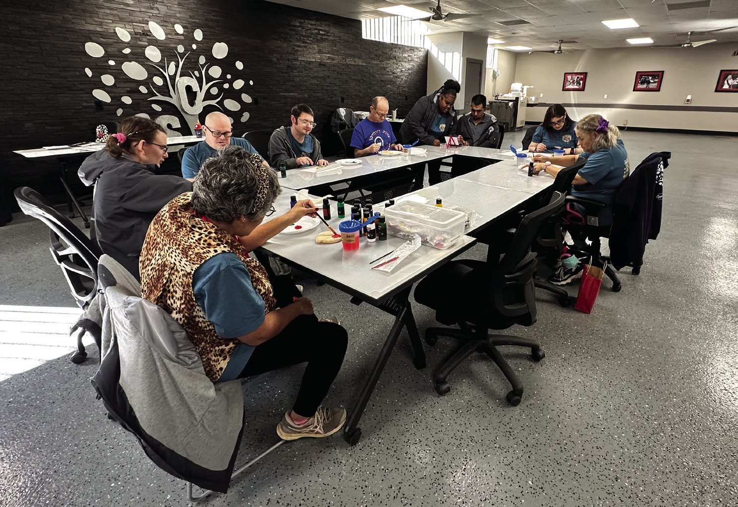 SCI Adult Day Center attendees participate in craft time. Photo provided