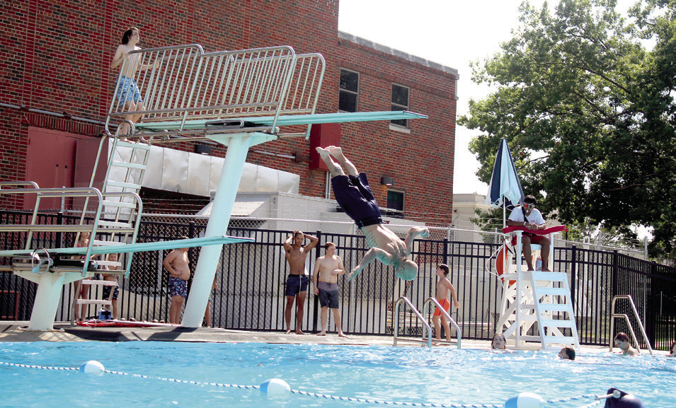 Two Shawnee Splash Water Park visitors use the one-meter and 3-meter diving boards in the deep pool on Sat., Aug. 6.