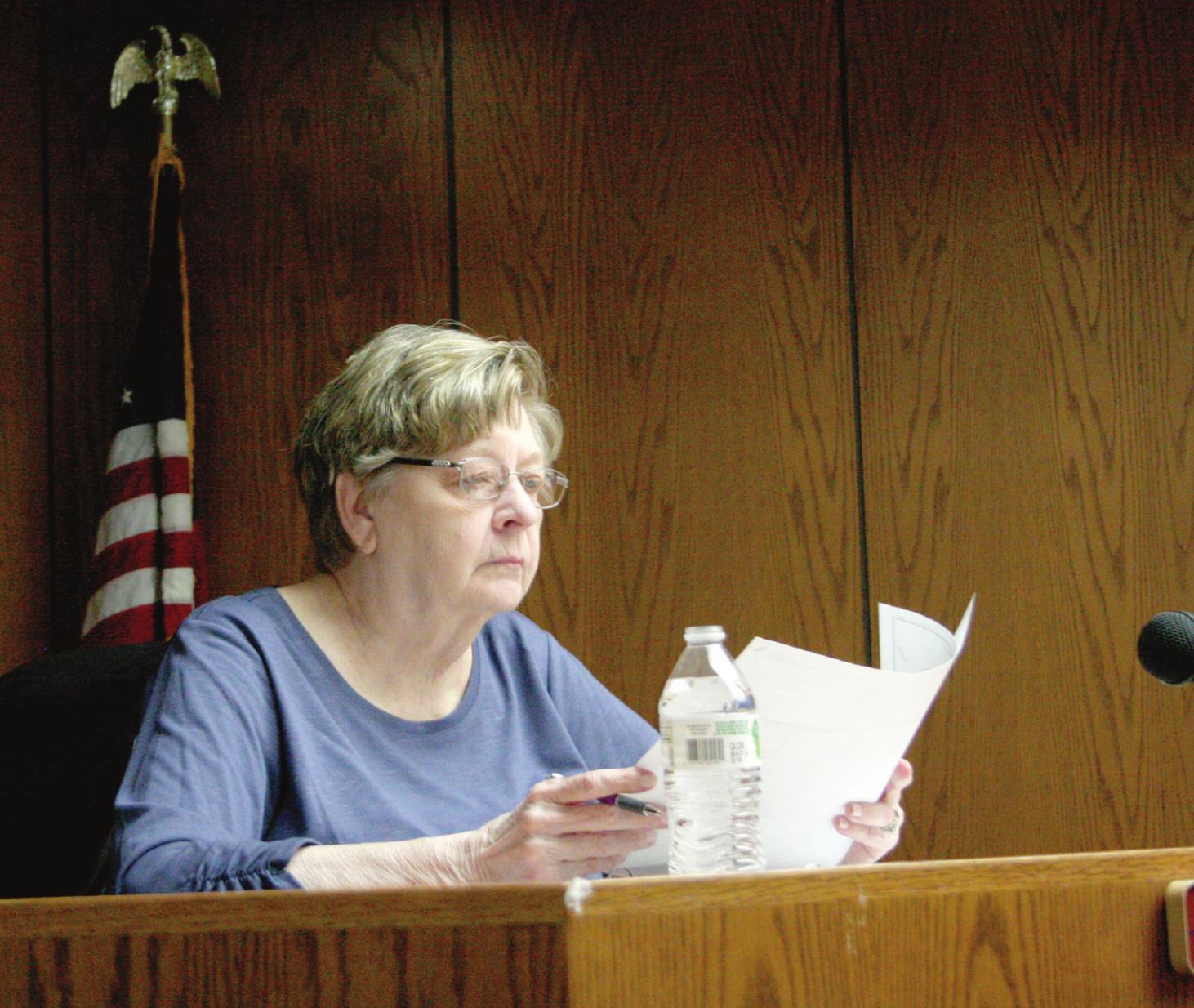 Ward 1 City Commissioner Linda Farris contemplates a proposed truck route map during Monday night’s Tecumseh City Council Meeting. Countywide &amp; Sun/Kendra Johnson