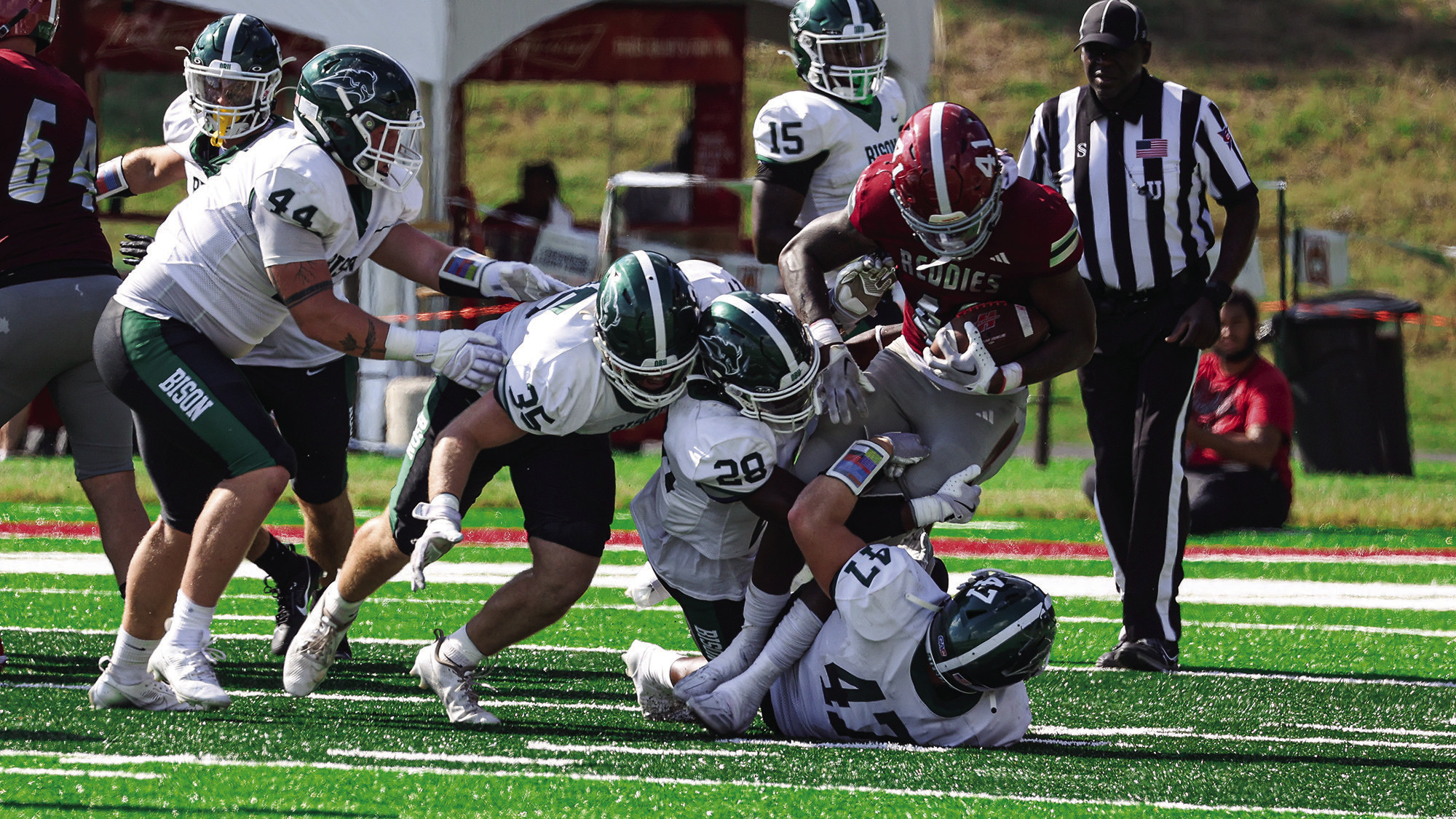 Bison swarm the Henderson player for the tackle. Oklahoma Baptist lost the game 52-7. Photo provided by OBU
