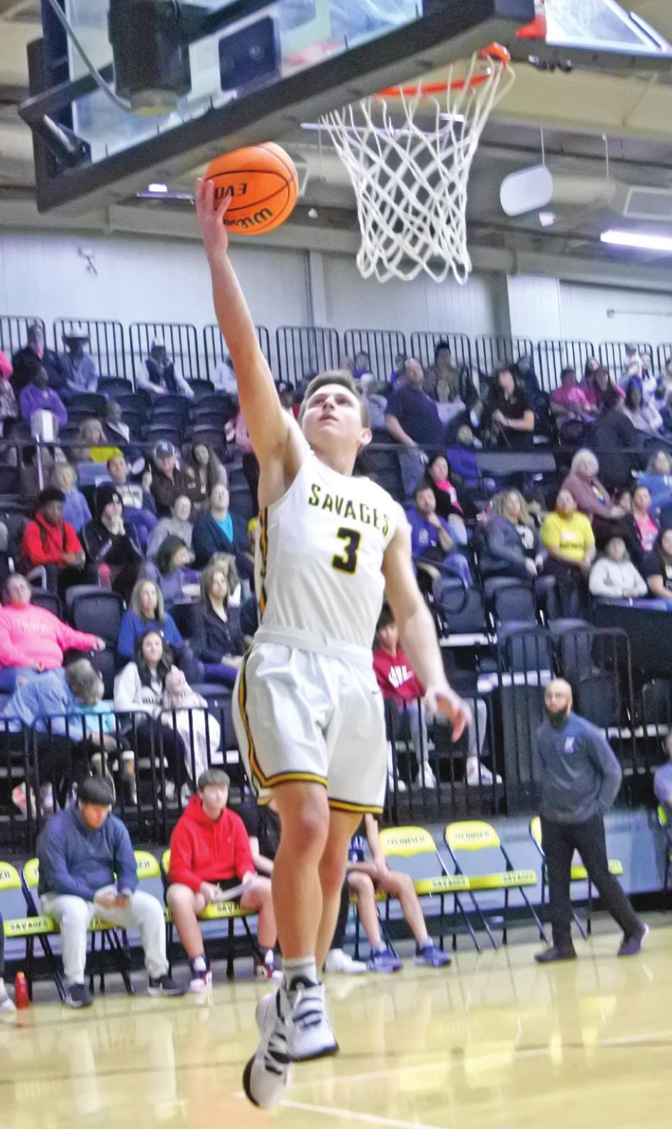 Tecumseh’s Brady Overstreet tries for a basket during the homecoming game against Little Axe on Jan. 28. The Savages won 72-35.