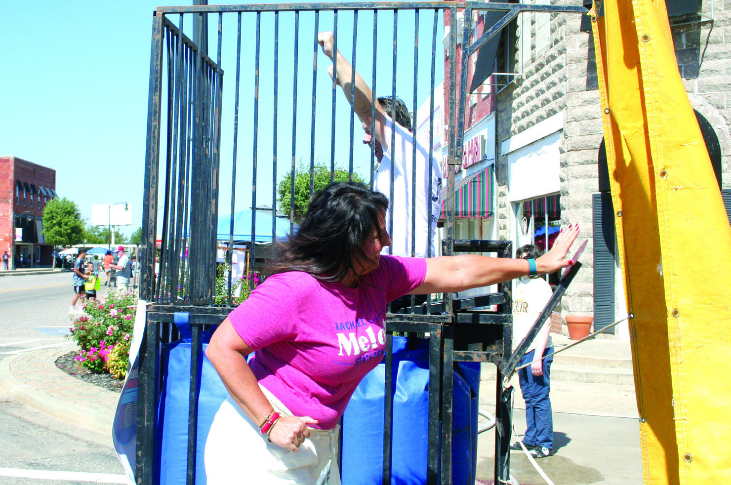 Rachel Melot pushes the lever to dunk Oklahoma State Senator Shane Jett in the Frontier Days Dunk Tank on Sept. 30. Tecumseh Superintendent Robert Kinsey and Pastor Jerry Kuhn also took their turns in the tank. Countywide & Sun/Natasha Dunagan