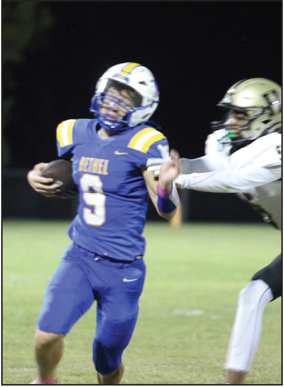 Bethel sophomore Maddox Davis tries to dodge being tackled while carrying the ball at the Oct. 4 home game with Hugo. The Wildcats lost, 24-38. File photo