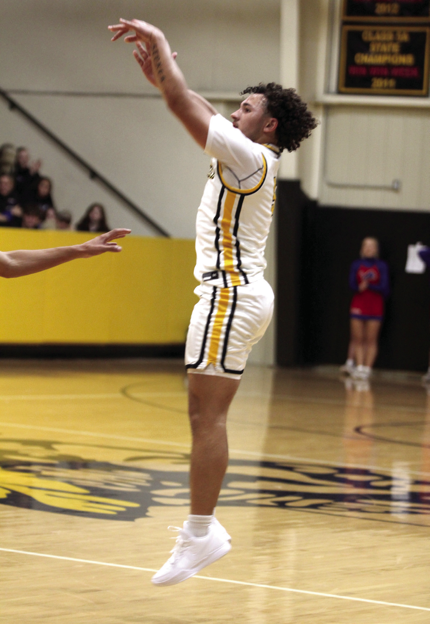 Tecumseh senior Aveon Stokes sinks a three-point shot in the Dec. 5 home game against Chandler. The Savages lost 74-81, and the Lady Savages lost 34-57 earlier that night. Natasha Dunagan, Countywide & Sun