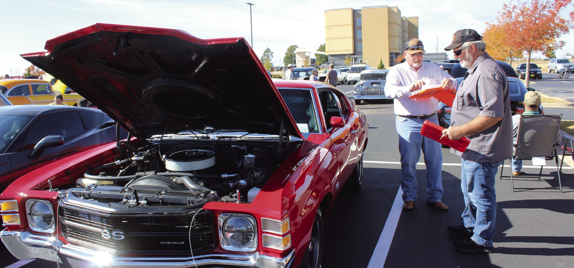 Pott. Co. Commissioner Greg Rush and Shawnee Mayor Eric Stephens judge a 1971 Chevelle SS at the First Annual Driven for Justice Car Show, held at Life. Church in Shawnee on Nov. 8. The car show raised more than $5,000 for the Child Advocacy Center of Central Oklahoma. Natasha Dunagan, Countywide &amp; Sun