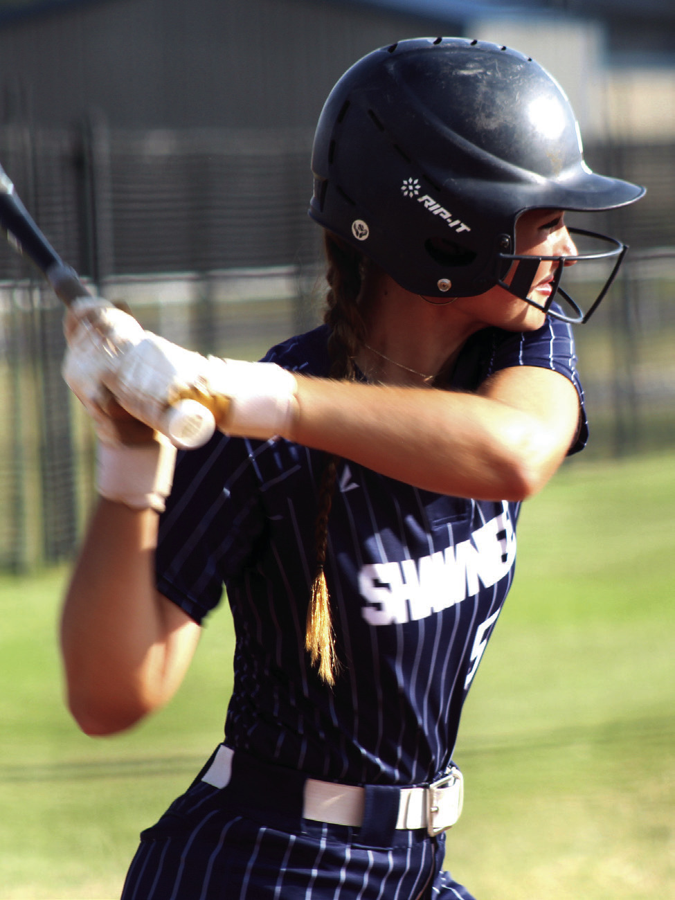 Shawnee senior Taylor Bailey prepares for a hit at bat during the Sept. 24 Senior NIght home game against Del City. Bailey also sang the national anthem to kick off the game.