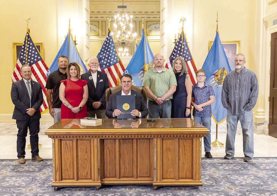 Pictured in no particular order are Rep. Danny Sterling, Walter Morris, Candi Morris, Rusty Bias, Gov. Kevin Stitt, Jace Bias, Kari Bias, Matt Bias, and Gary Wallis. Photo provided