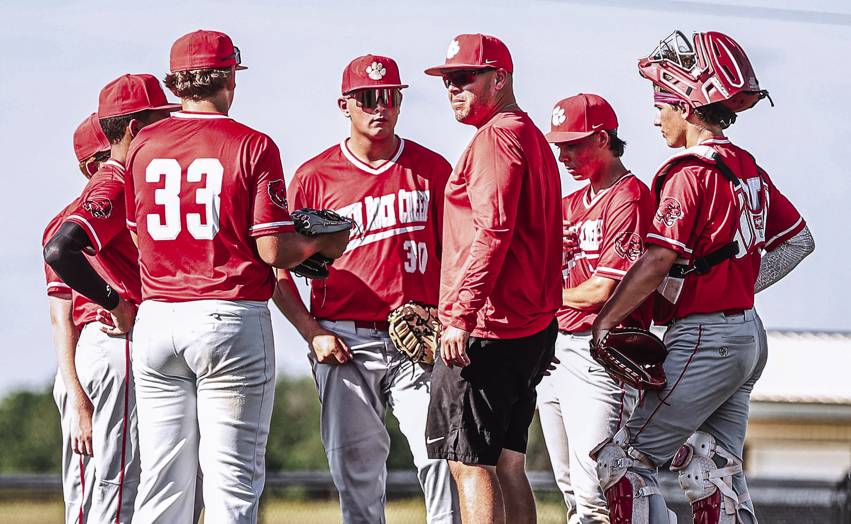 North Rock Creek baseball coach Keaton Hernandez has a chat with the infield on June 16. NRC beat Cushing 10-9, improving their record to 4-2 in the summer league. Photos Courtesy of Gowin Photography