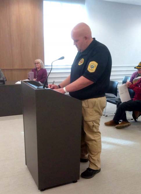 Sheriff’s Deputy Jared Strand reviews disposal requests with the County Commissioners. Countywide & Sun/Bill Rooth