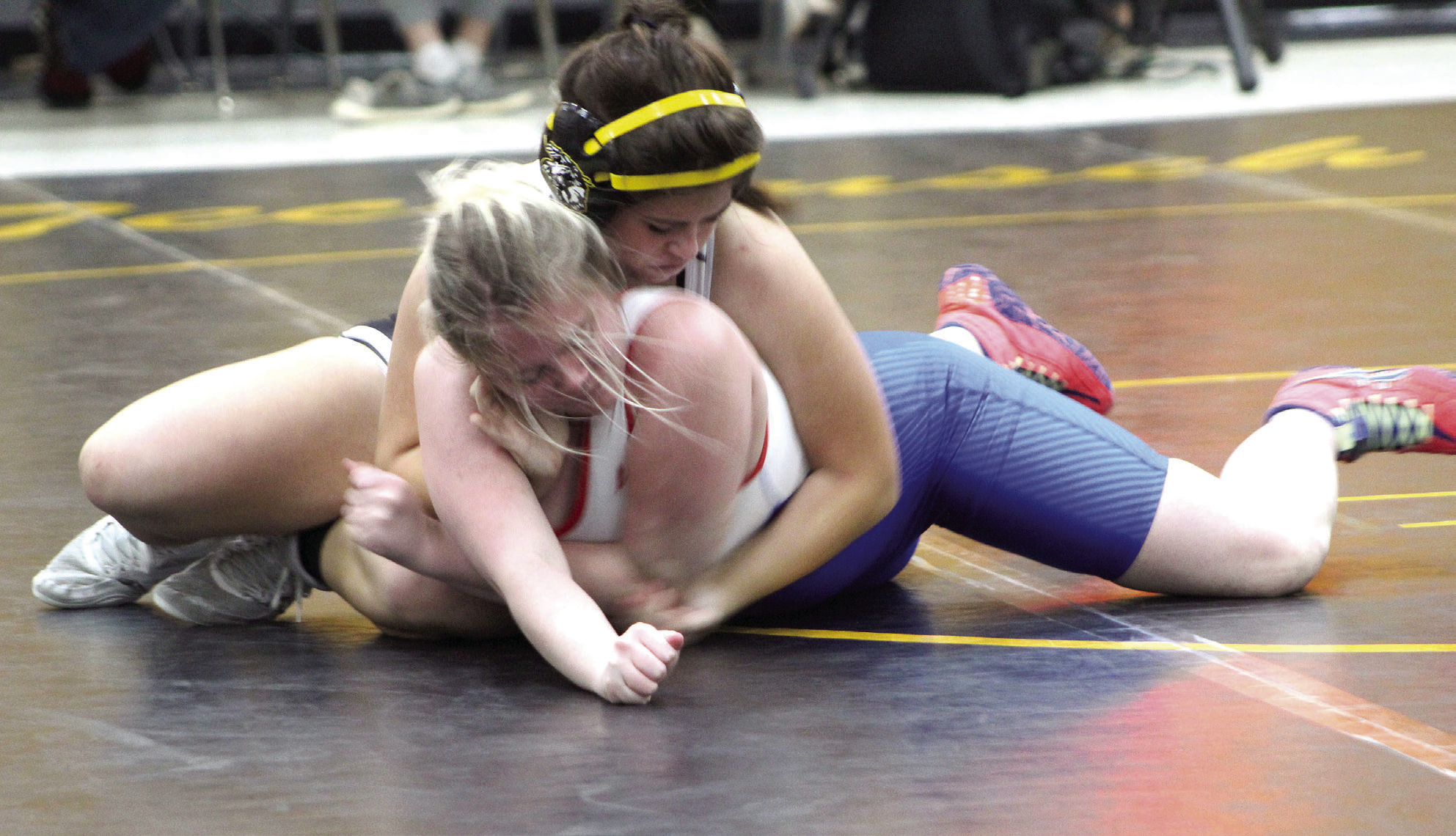 Tecumseh wrestler Jessica Fullbright tries to flip her Chandler opponent on Dec. 15 during a meet at the Alumni Center. The Tecumseh Lady Savages won 42-11. Countywide &amp; Sun/ Natasha Dunagan