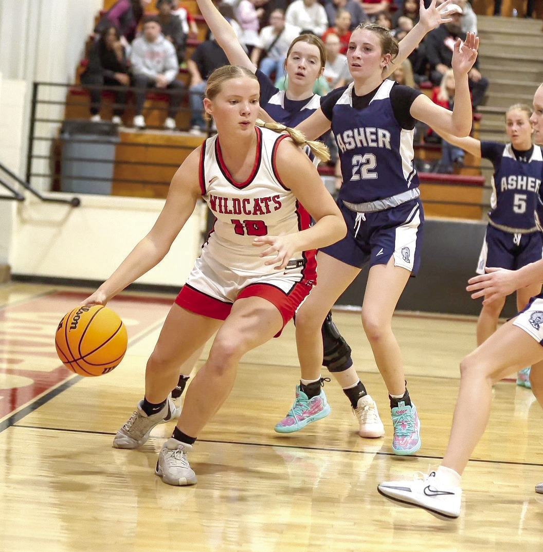 Earlsboro freshmen Peighton Worley drives around Asher.