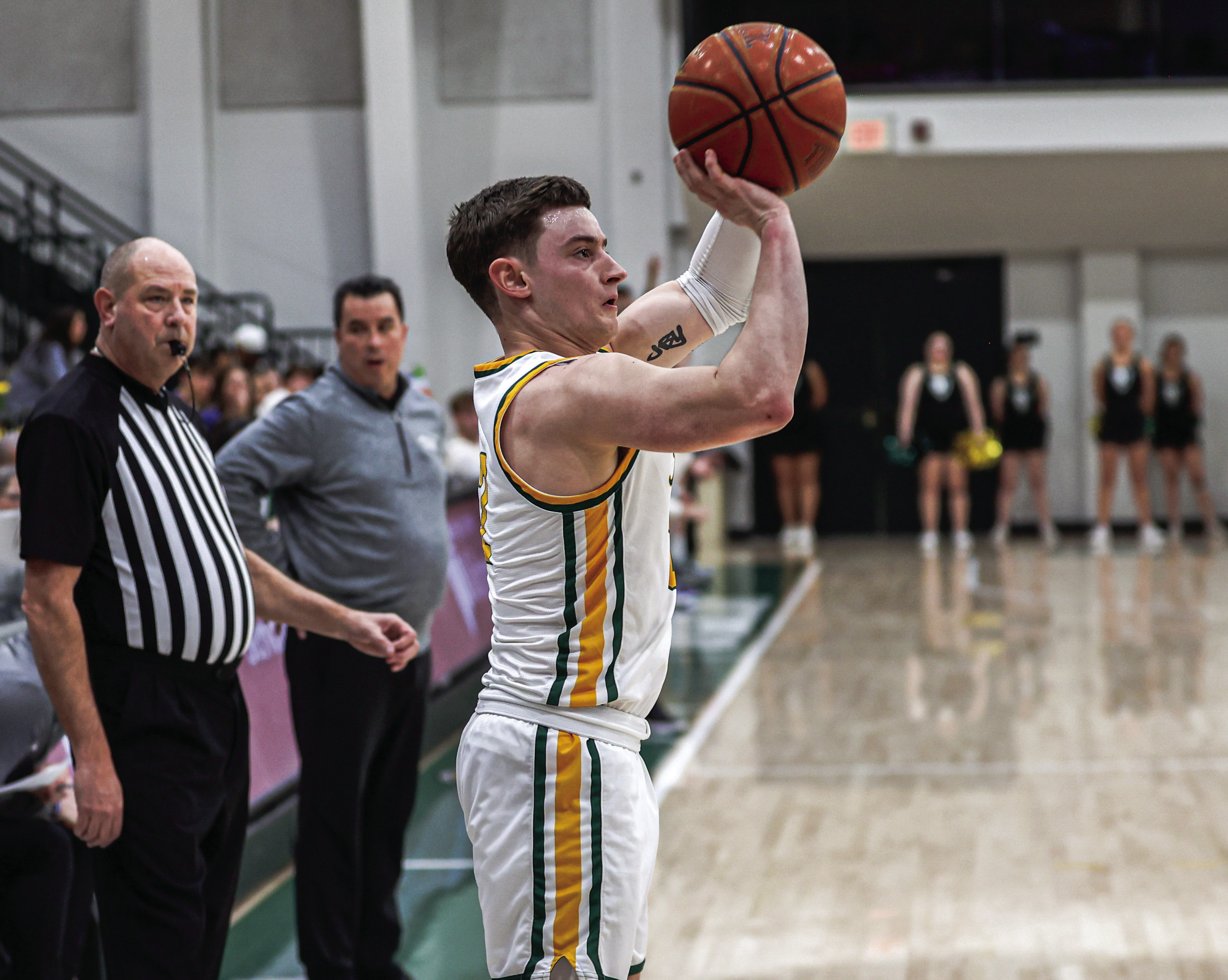 Oklahoma Baptist University’s Ethan Scott launches a three-point shot in the 75-72 win over Henderson Saturday, Jan. 18. Scott finished the game with a career-high 22 points. Photo provided by OBU