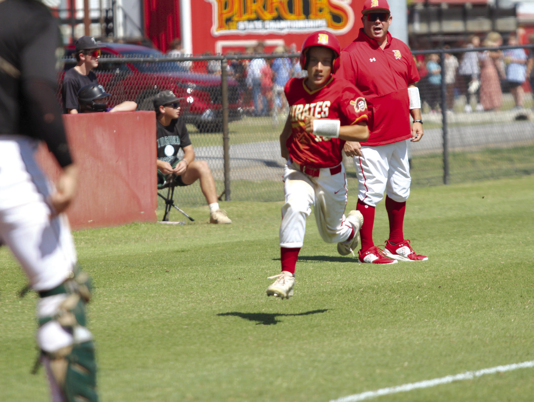 Dale junior Kam Wilson runs home in the second inning of the Sept. 5 Tushka game during the Asher Festival of Champions baseball tournament. The Pirates won that game, 10-2, and the game with Calumet on Sept. 6, 9-1. Games were played at Dale and Asher with eight other teams from across the area. Countywide & Sun/ Natasha Dunagan