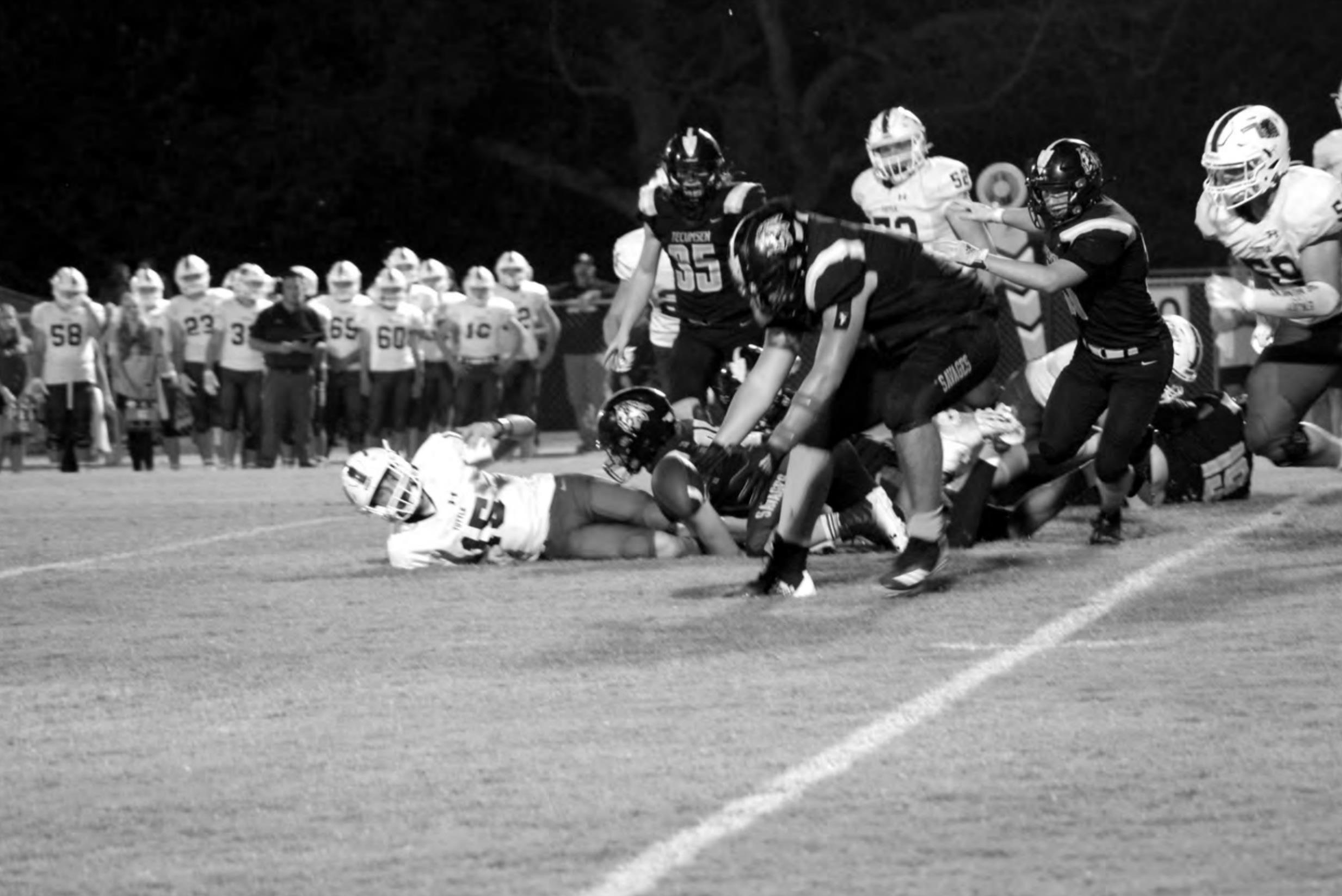 Tecumseh senior Brennon Carter recovers a ball fumbled by a Tuttle player during the home game on Oct. 1. Tecumseh lost 0-44. Countywide &amp; Sun/Natasha Dunagan
