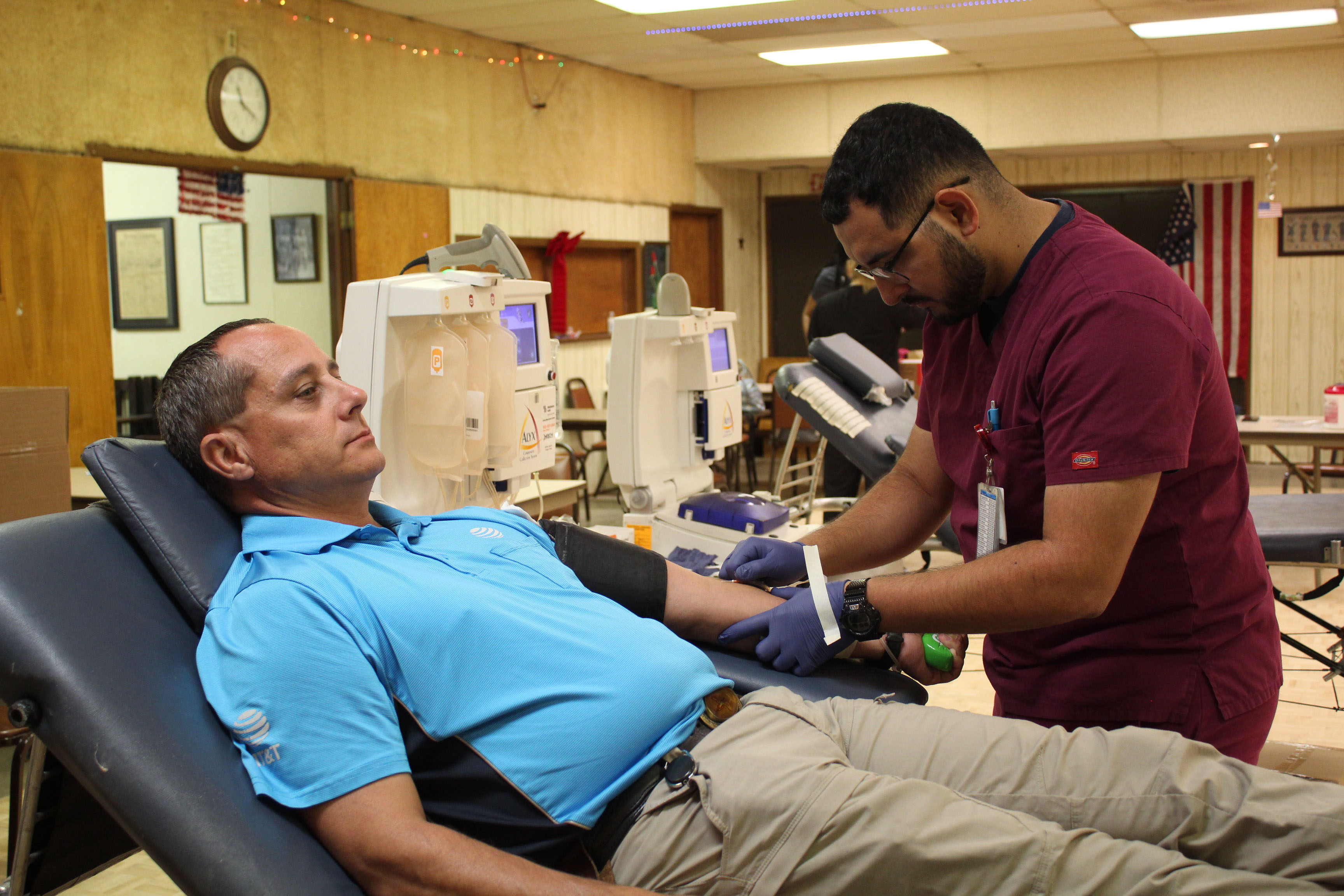Marcos Maldonado, a phlebotomist-apheresis technician, draws blood from Jeromy Sowder, of Pink, at the annual Tecumseh Community Blood Drive, organized by the Tecumseh Chamber of Commerce and held at American Legion Hill-Huett Post 260 on June 27.