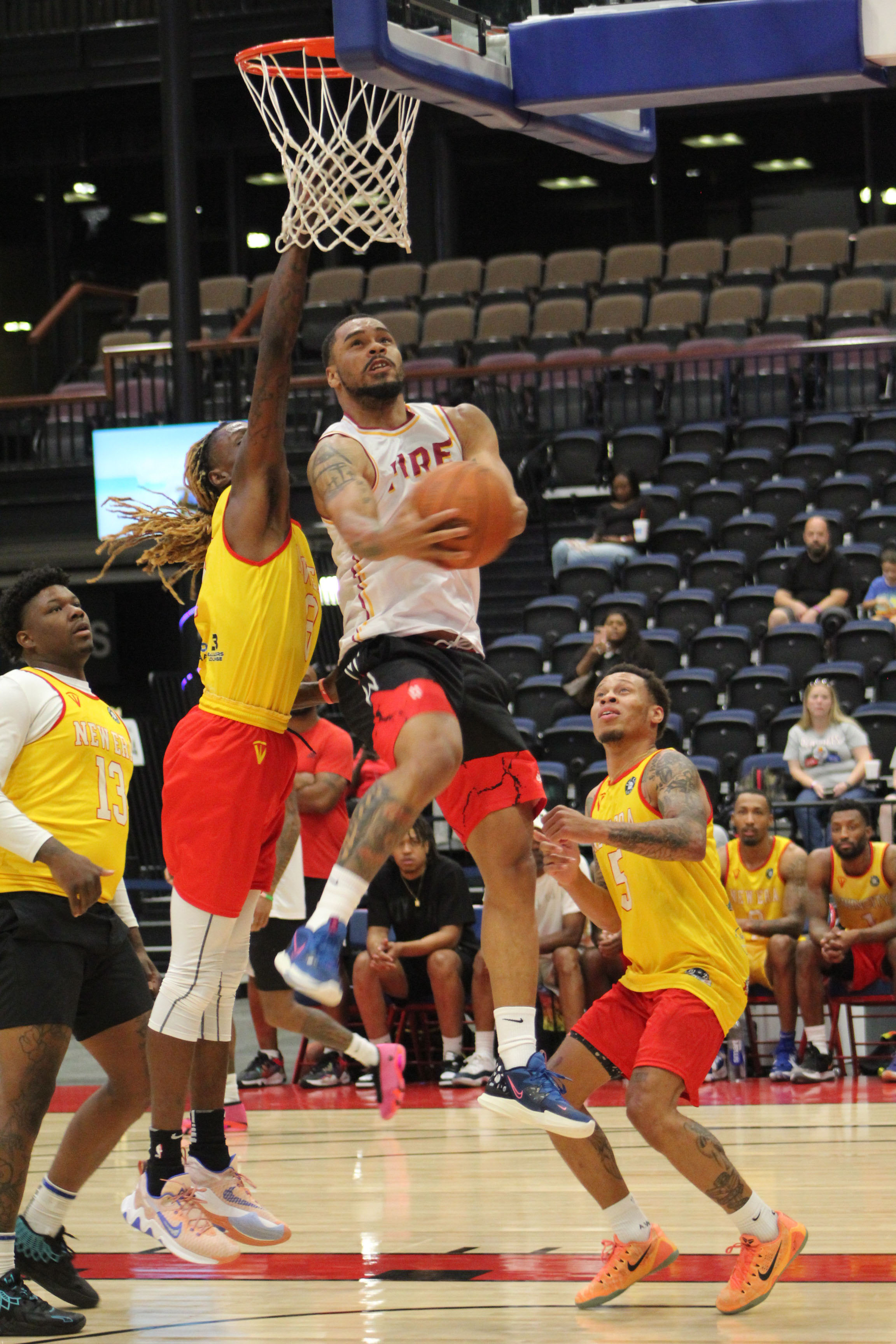 The MVP of the TBL, DeShawn Munson, goes in for a basket during the FireLake Arena Fall Shootout Basketball Tournament on Oct. 15. Munson was playing on the "Shawnee Fire" team against "New Era," and there were seven teams total in the pro-am tournament held at FireLake Arena and the Shawnee YMCA. The Fire won first in the tournament. Countywide & Sun/Natasha Dunagan