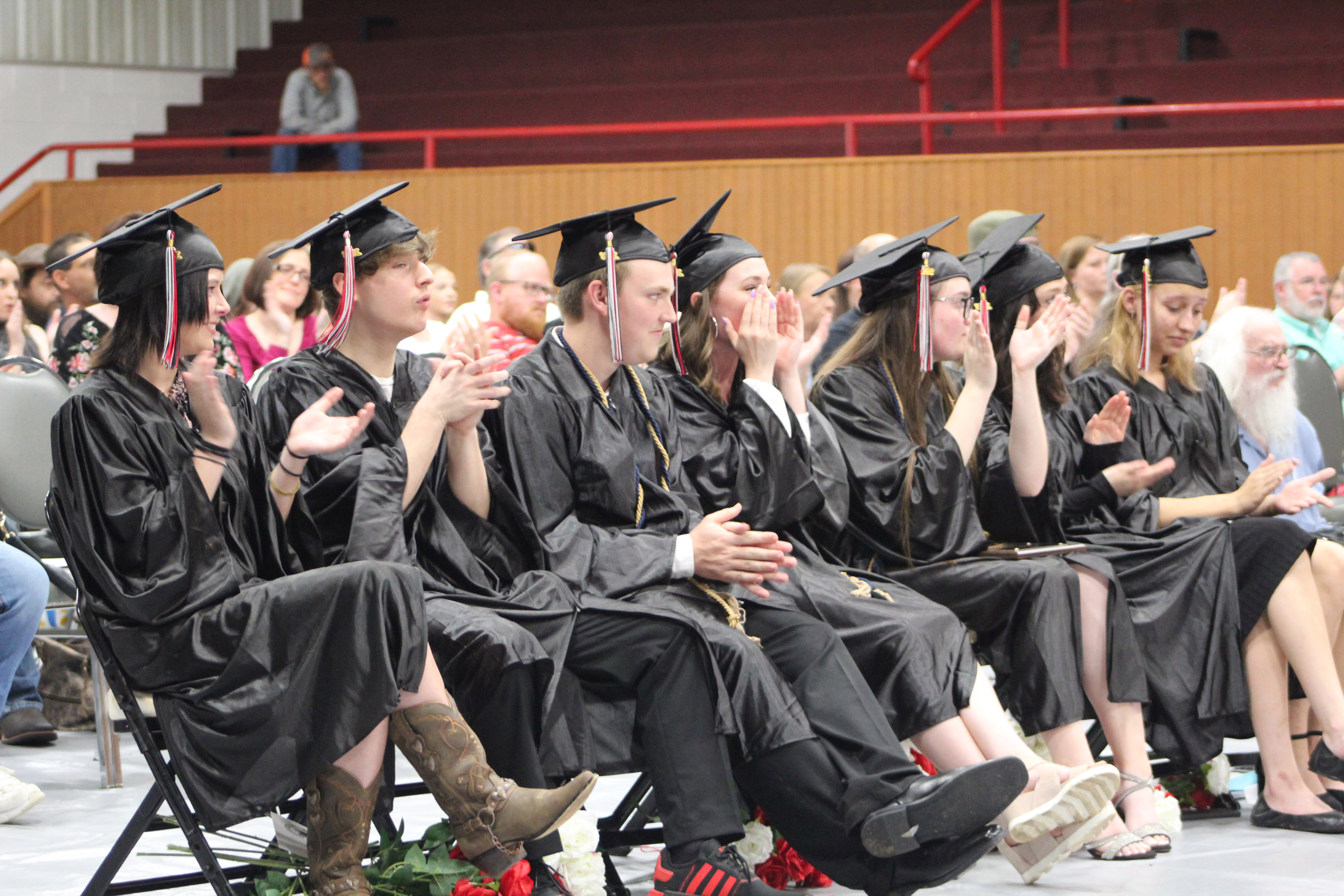 Macomb High School graduates clap and cheer for English teacher Mandy Blankenship after her speech during the Commencement Ceremony on May 6. Countywide & Sun/Natasha Dunagan
