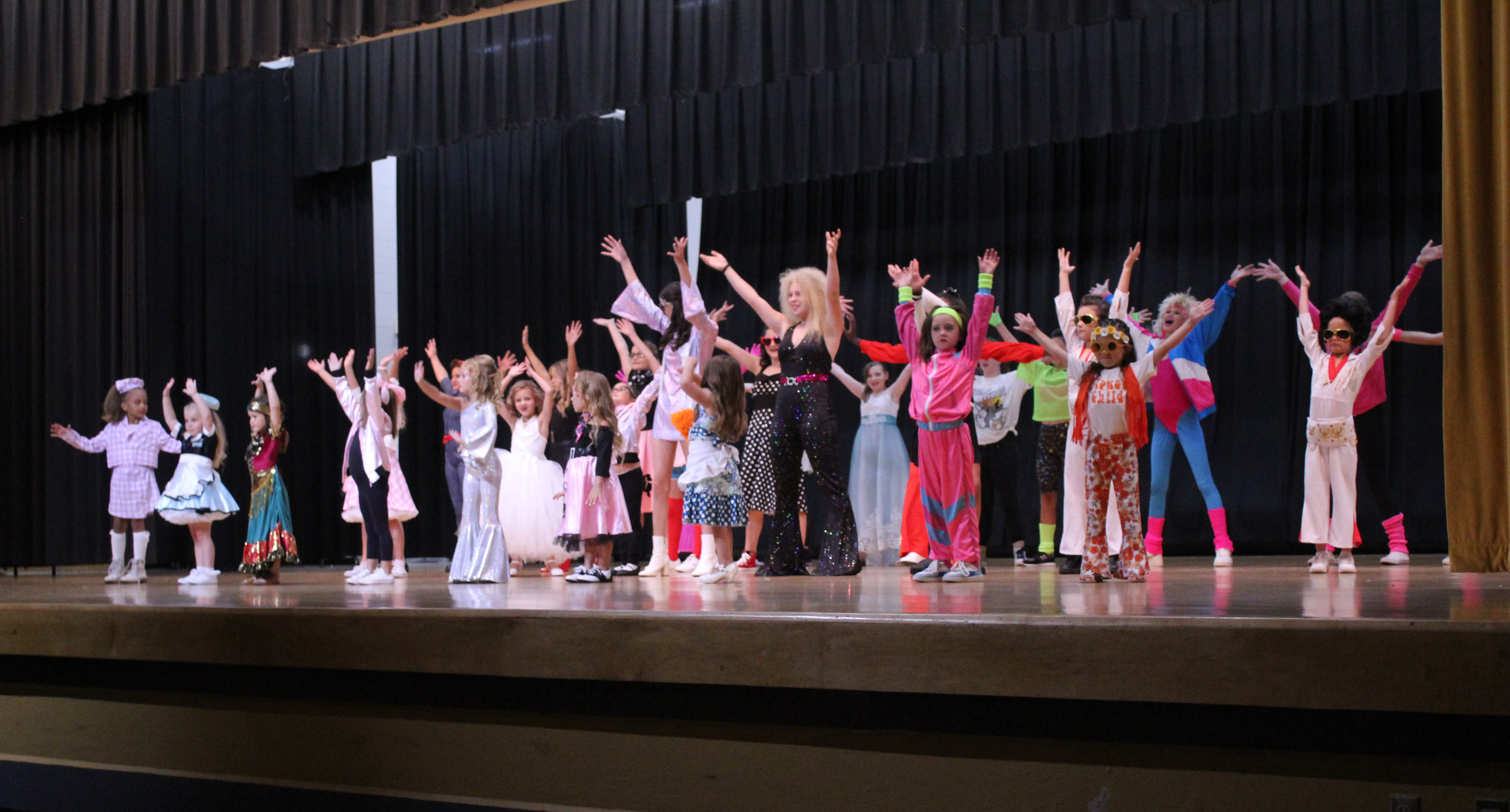 Twenty-seven contestants in the Tot, Little, Junior and Miss Frontier Days Pageant perform the musical number dressed in period costumes for the “Remember When” theme. The pageant was held on Sept. 24 at the W.P. Wood Alumni Center at Tecumseh High School, but the Junior and Miss contestants will be crowned before the Frontier Days Parade on Sept. 30. Countywide & Sun/Natasha Dunagan