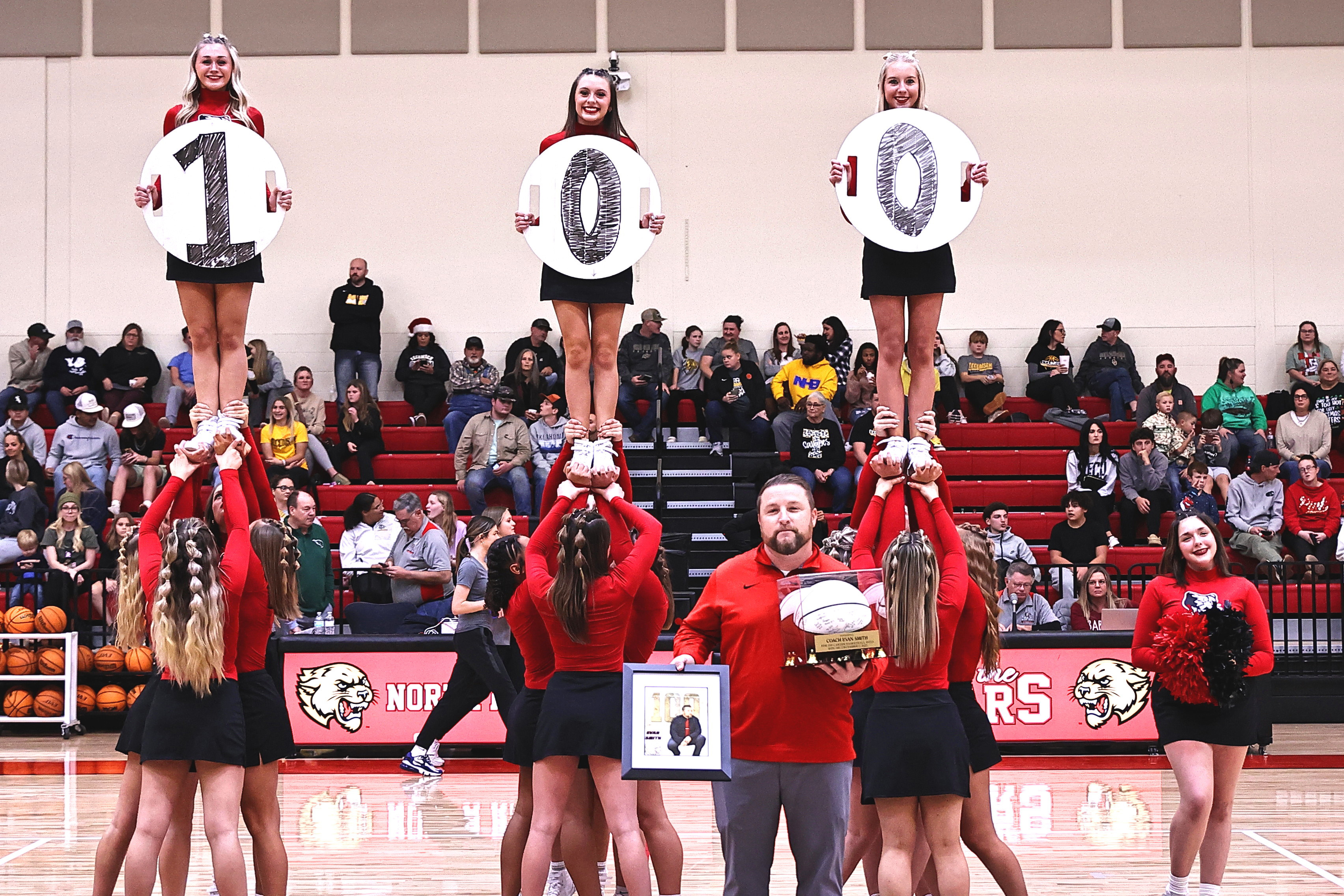 North Rock Creek recognized Coach Evan Smith for his 100th win as a head coach, Tuesday, Dec. 12. The NRC back-2-back State softball championship team was also recognized. NRC played Tecumseh Tuesday night and won both games. Girl's score was 55-47 and the boys 71-38. Photo provided courtesy of Gowin Photography