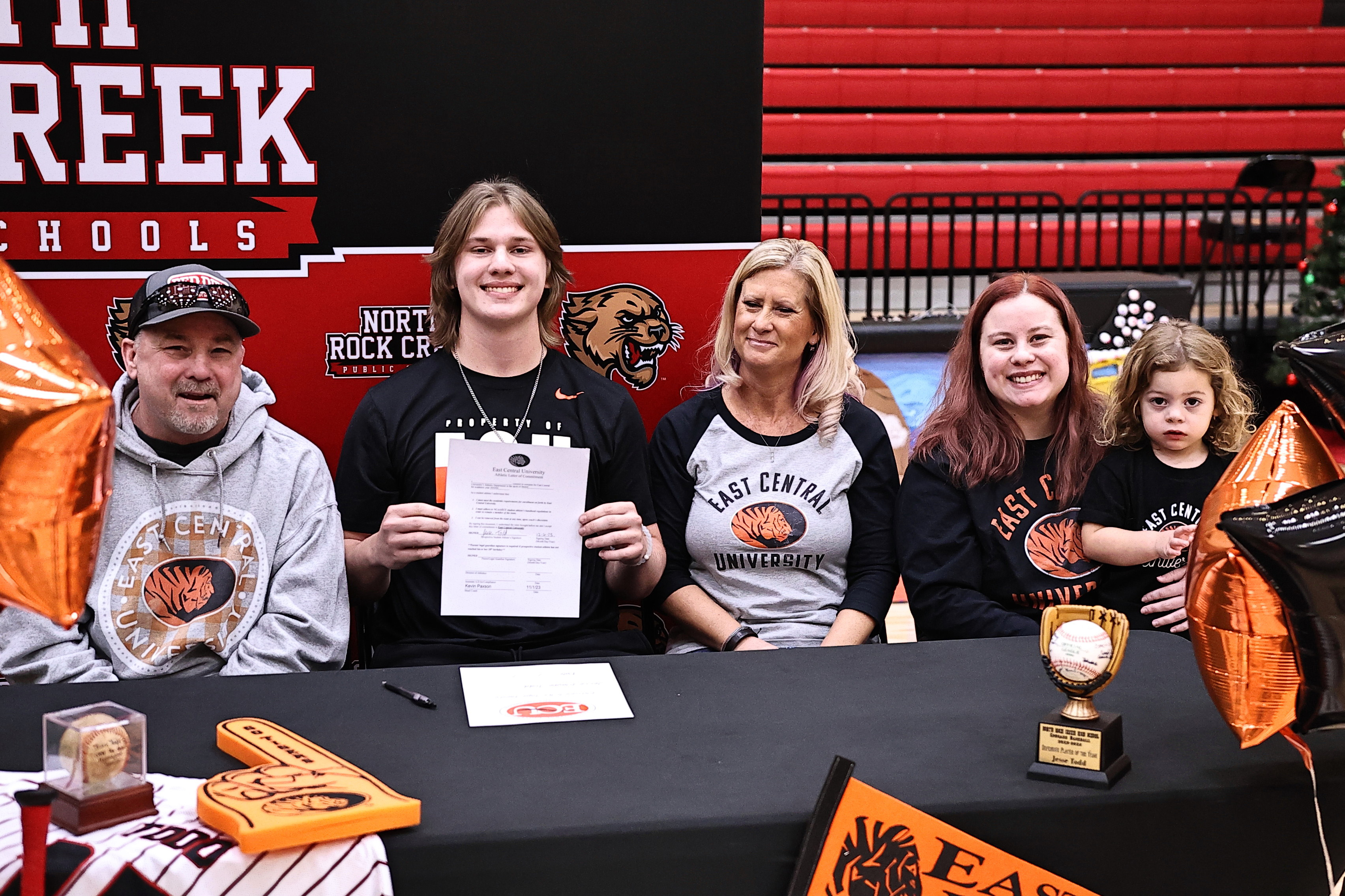 North Rock Creek's Jesse Todd signs with East Central University. Todd is picured seated between his parents (from left) Jeff, Jesse, and Darlene Todd. His sister Hannah and her son Kyler also attended the signing. Photo courtesy of Gowin Photography