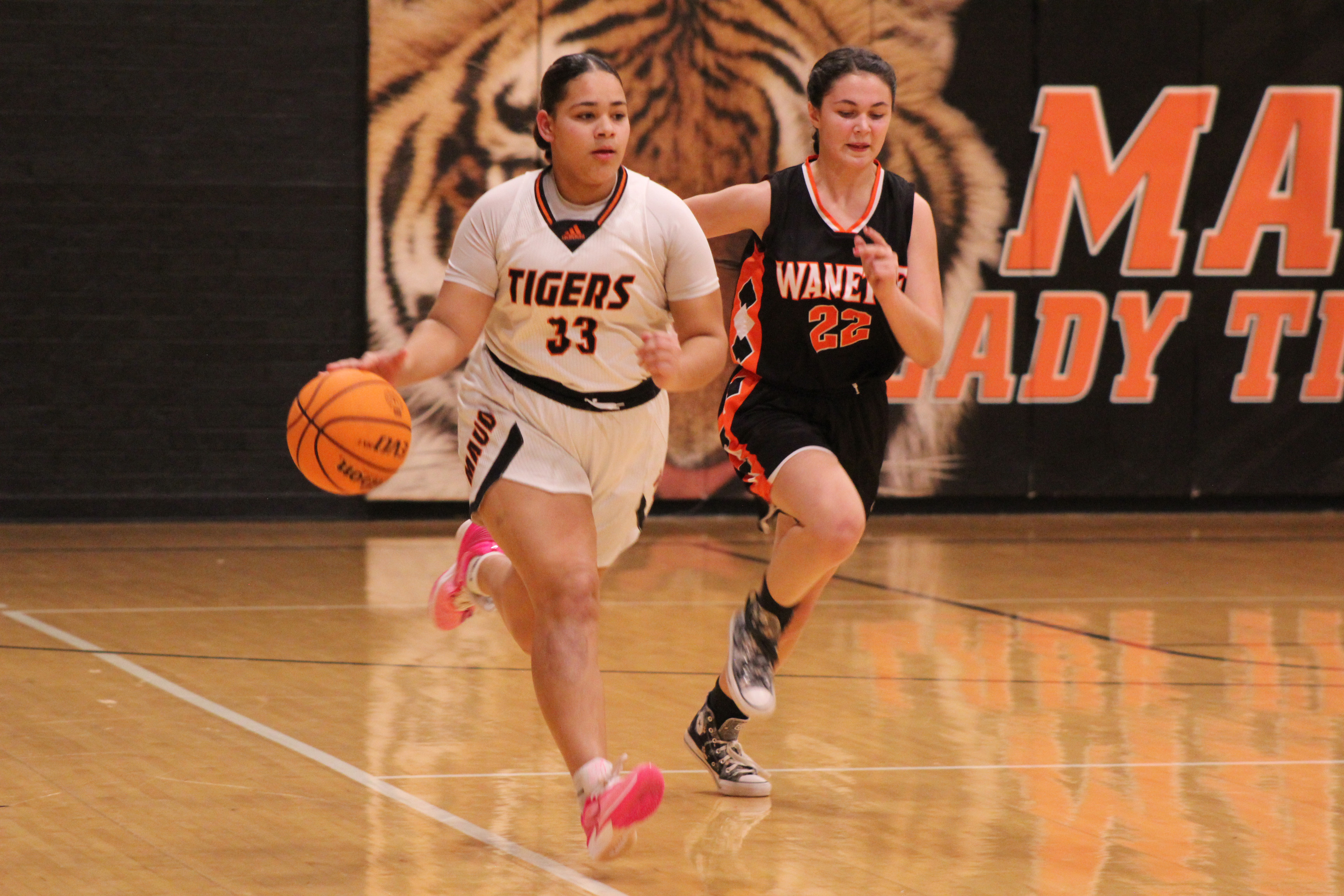 Maud’s Amerikus Street takes the ball up the court followed by Wanette’s Cala Tankslay in the third quarter of the Jan. 26 homecoming game.