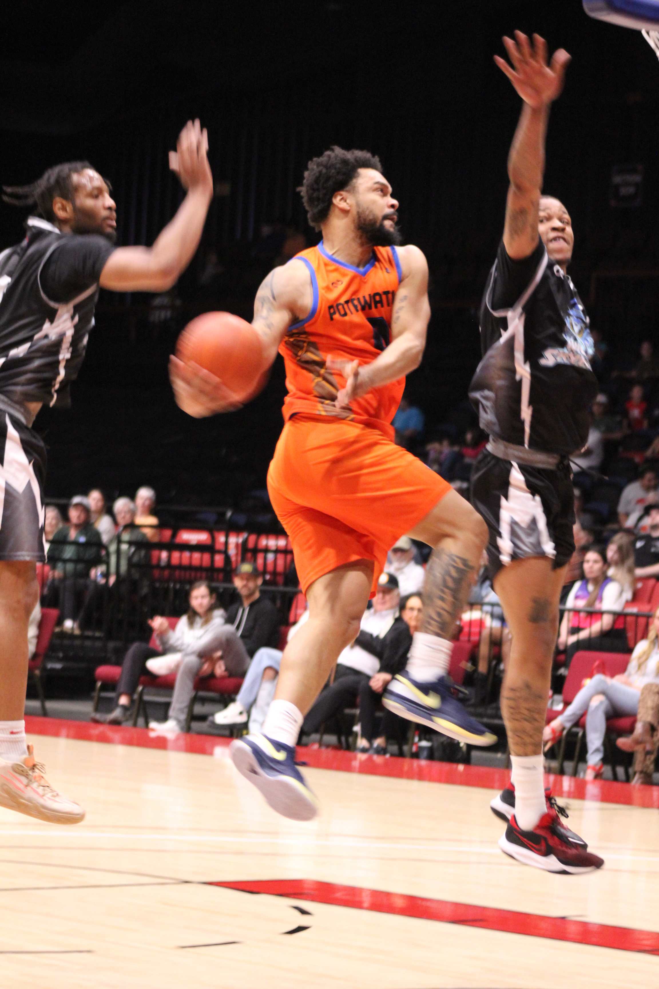 Potawatomi Fire point guard Deshawn Munson tries for a one-handed slam dunk in the fourth quarter of the home game with the Wichita Sky Kings on March 15. The Fire won, 148-125. Countywide & Sun/Natasha Dunagan
