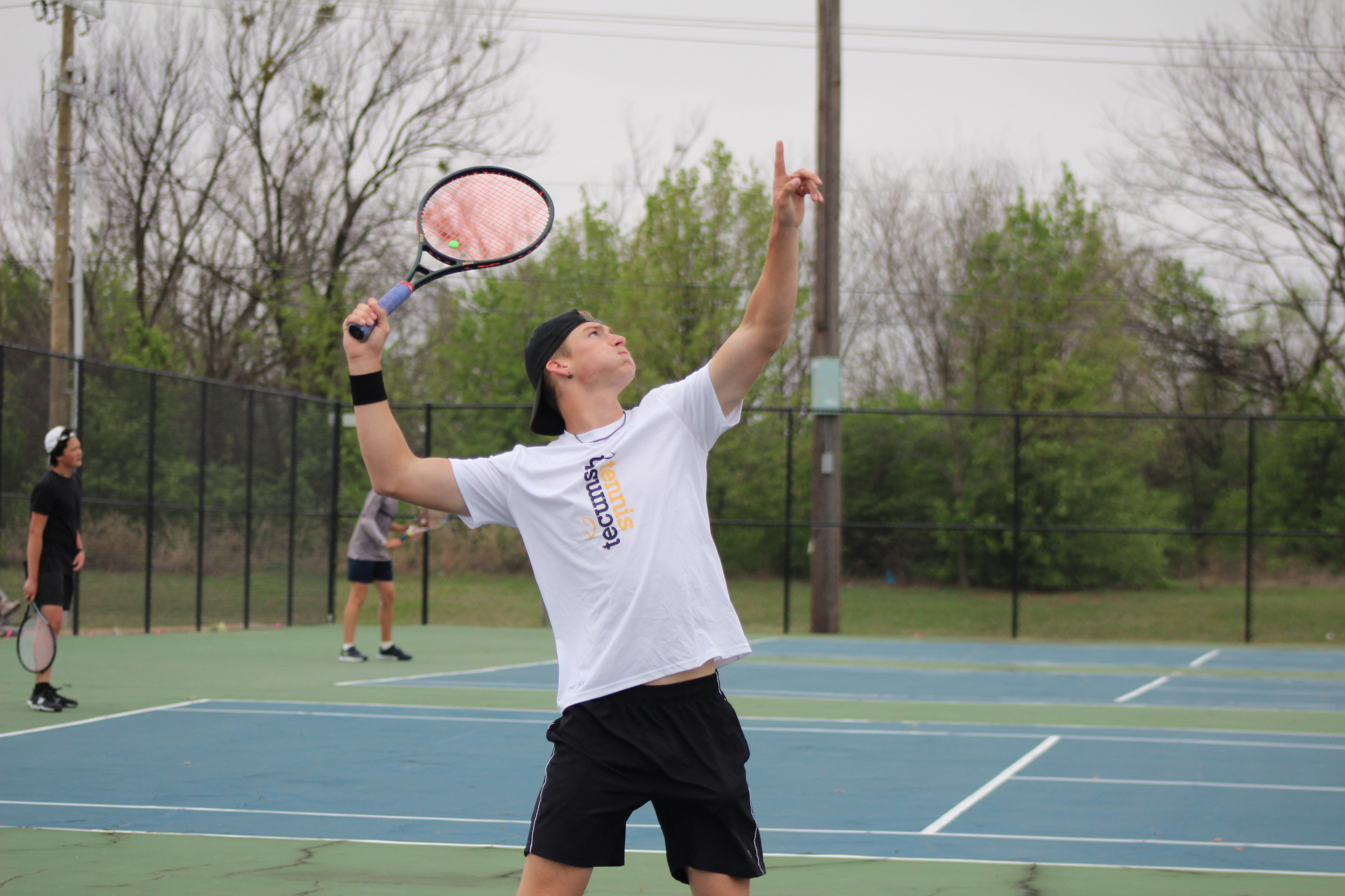 Tecumseh's Matthew Breed serves the ball during the Shawnee High School Tennis Tournament on March 15. There were eight schools playing that day, with the boys playing at SHS and the girls at OBU. Shawnee Boys Tennis Coach Dacia Jordan said this is the third time for their home courts to be used since the fences were replaced recently, after the April 2023 tornado damage. Jordan said whether they replace their building will depend on if the April 2 school bond passes. Countywide & Sun/Natasha Dunagan