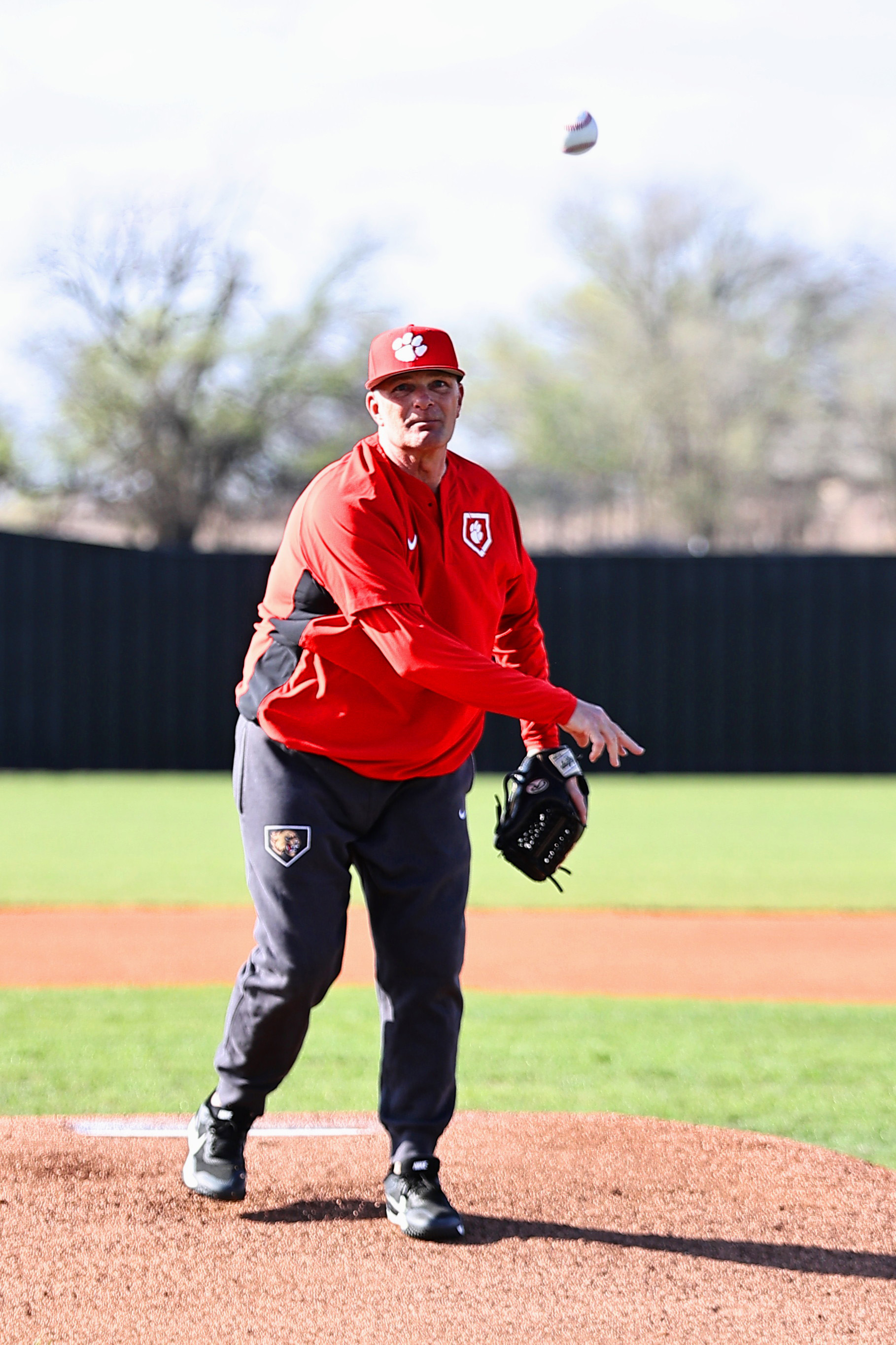North Rock Creek's high school principal Chad Brooking threw out the first pitch in the game between NRC and Cushing. NRC won 2-1 after losing to Cushing 4-8 on Monday, Mar. 11. Photo courtesy of Gowin Photography