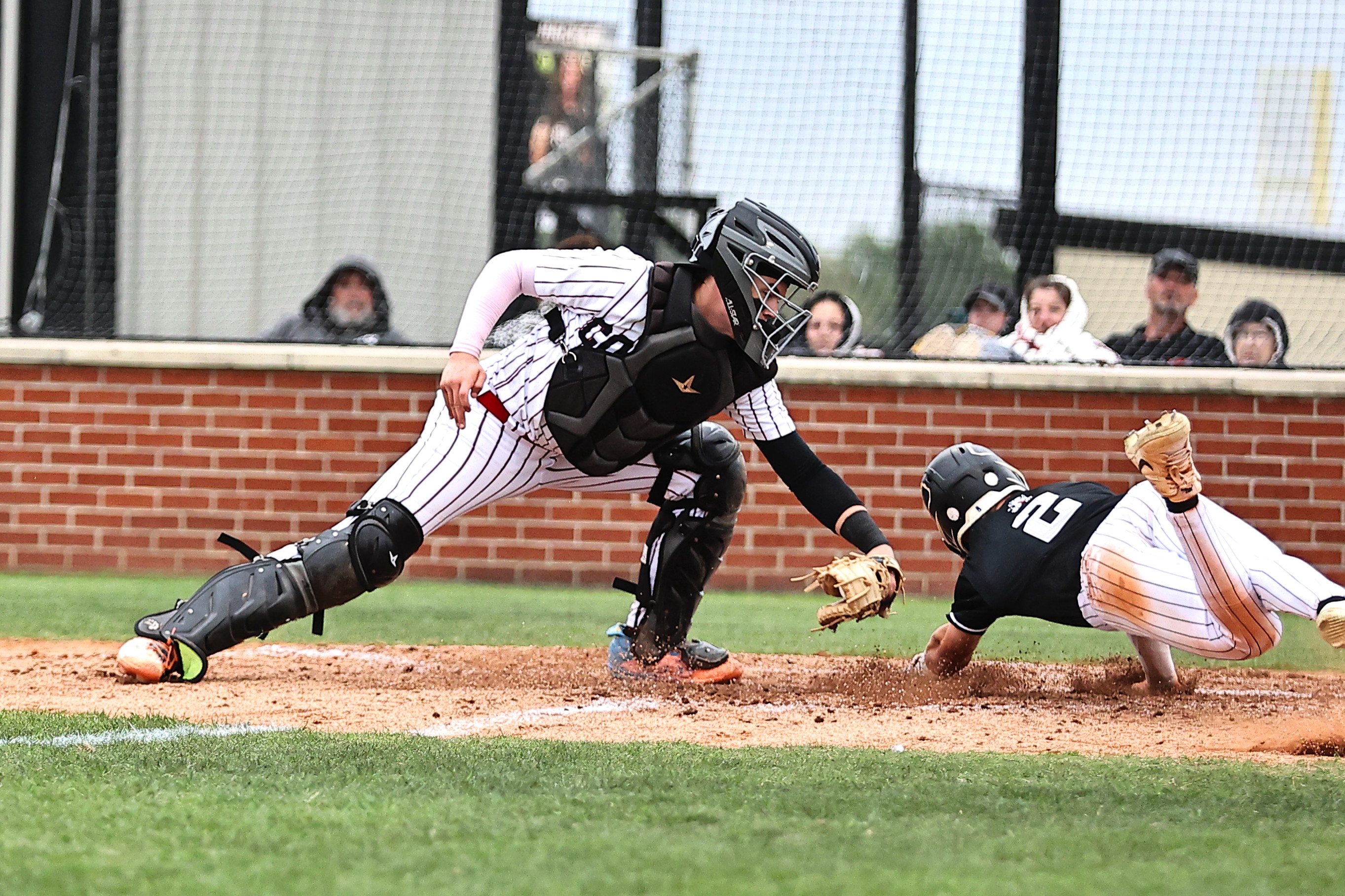 North Rock Creek's Braden Ueltzen tags the Perkins runner out at home. 