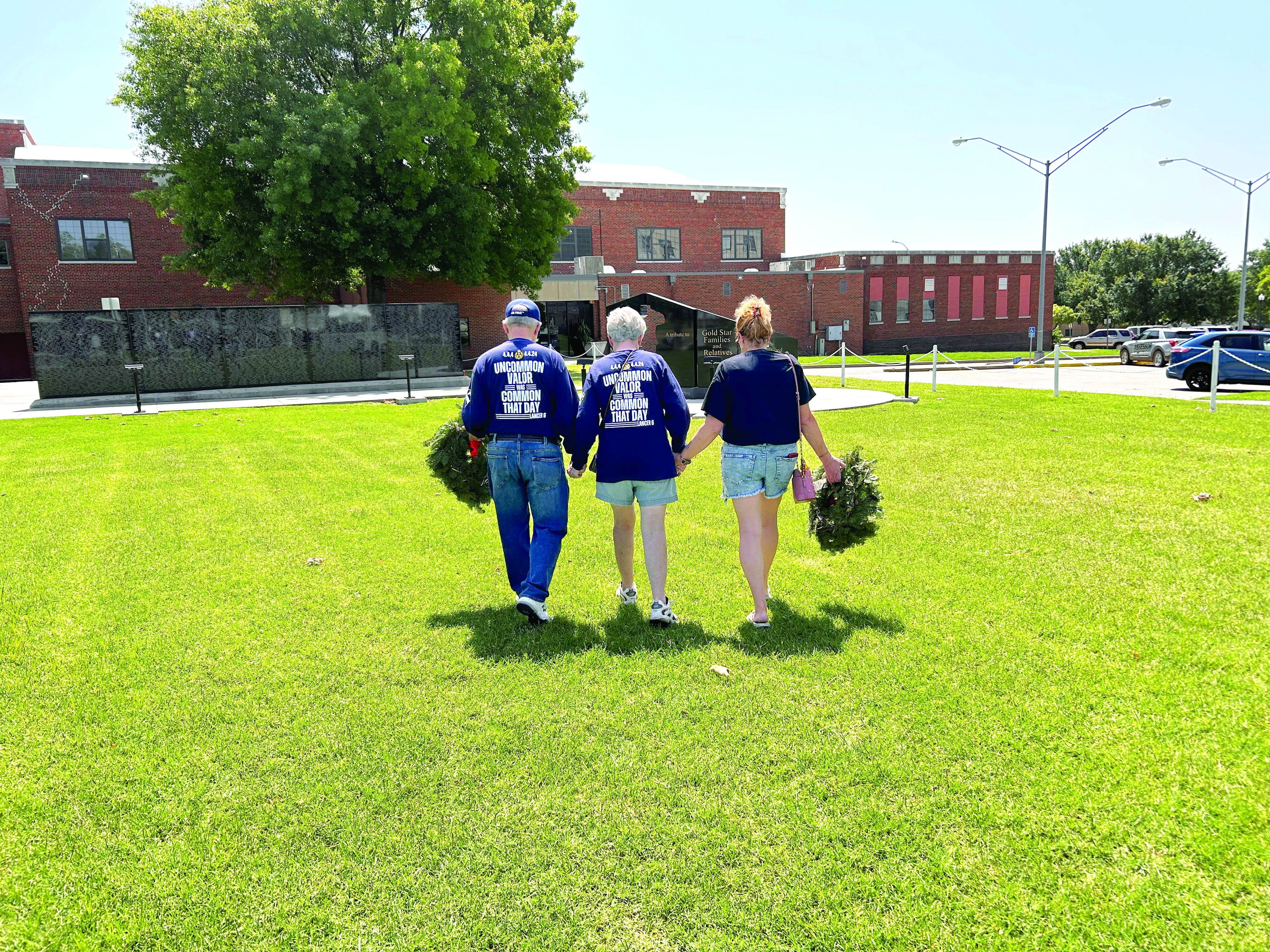 David and Linda Hendrickson and Donna Beth Warren walk in unity to the Gold Star monument at Woodland Veterans Park in Shawnee. The morning was filled with a lot of emotion from the families and those who attended the service. Countywide & Sun/Suzie Campbell
