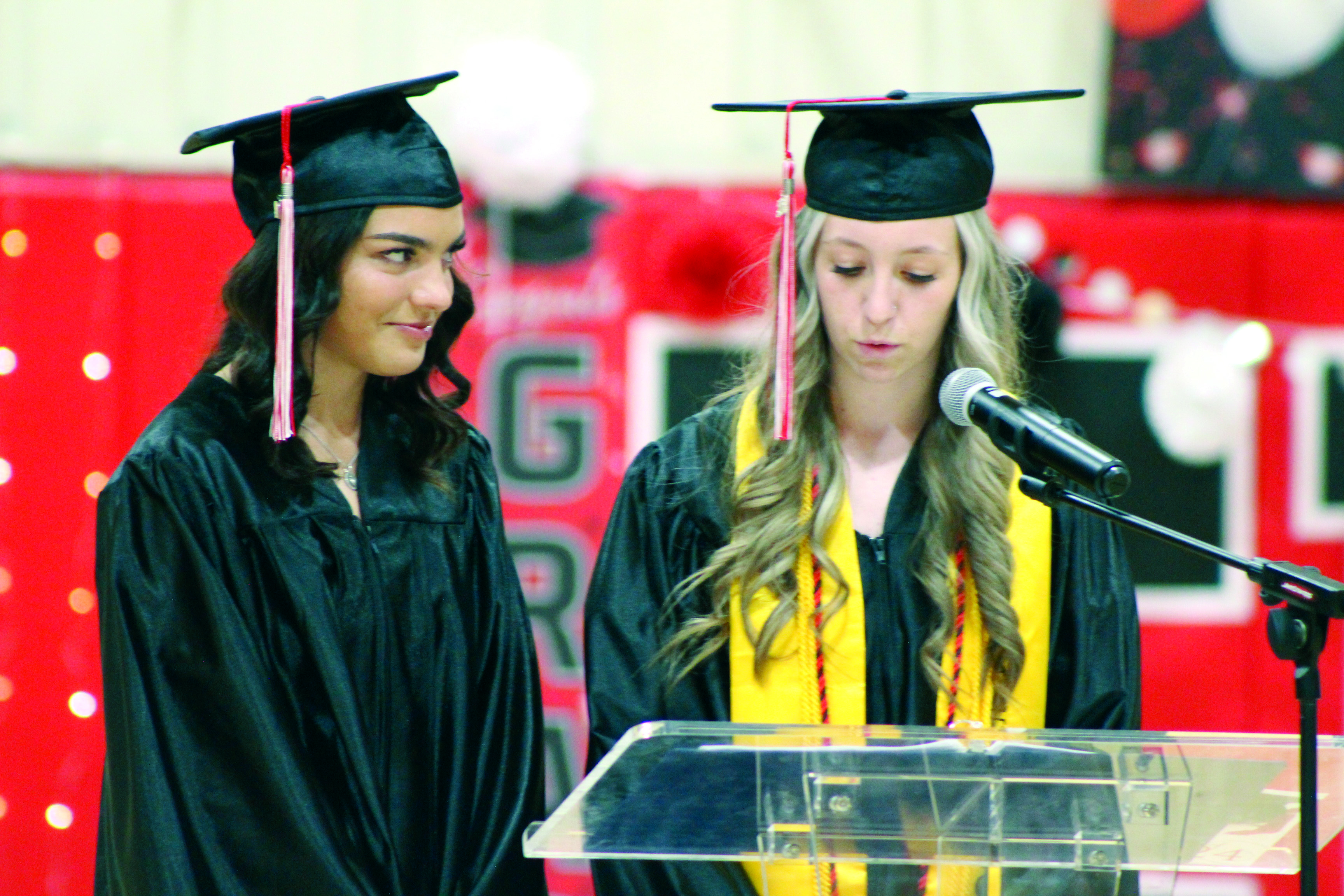 Earlsboro Graduates Jayleen Castaneda and Kaitlyn Chambers read the 2024 Class History at graduation on May 10. Countywide & Sun/Natasha Dunagan