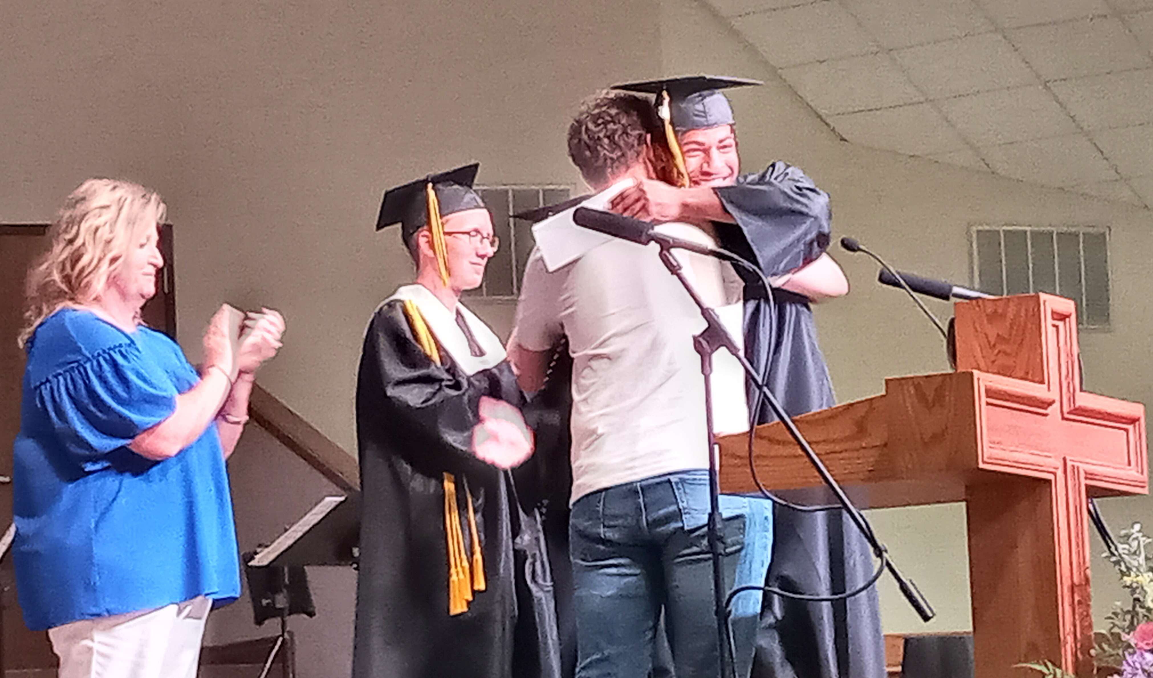 During Tecumseh's Baccalaureate on May 19, Graduate Marquan Krush received the Tiffany Fowler-Tiffin Outstanding Christian Leadership Award and a hug from Tiffany's brother, Kyle Fowler. Coach Kortney Ozment, far left, also spoke about the award's namesake. Countywide & Sun/Natasha Dunagan