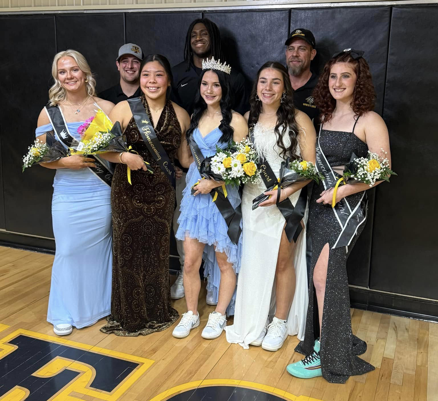 Tecumseh High School held their Wrestling Homecoming Ceremony on Feb. 4 and crowned Vivian Hayes as queen. Shown, from left, are Embrie Smith, Coach Ramirez, Zariyah Masquas, Coach Wright, Hayes, Trinity Rakestraw, Coach Sigman and Kylei Gokey. Photo provided.