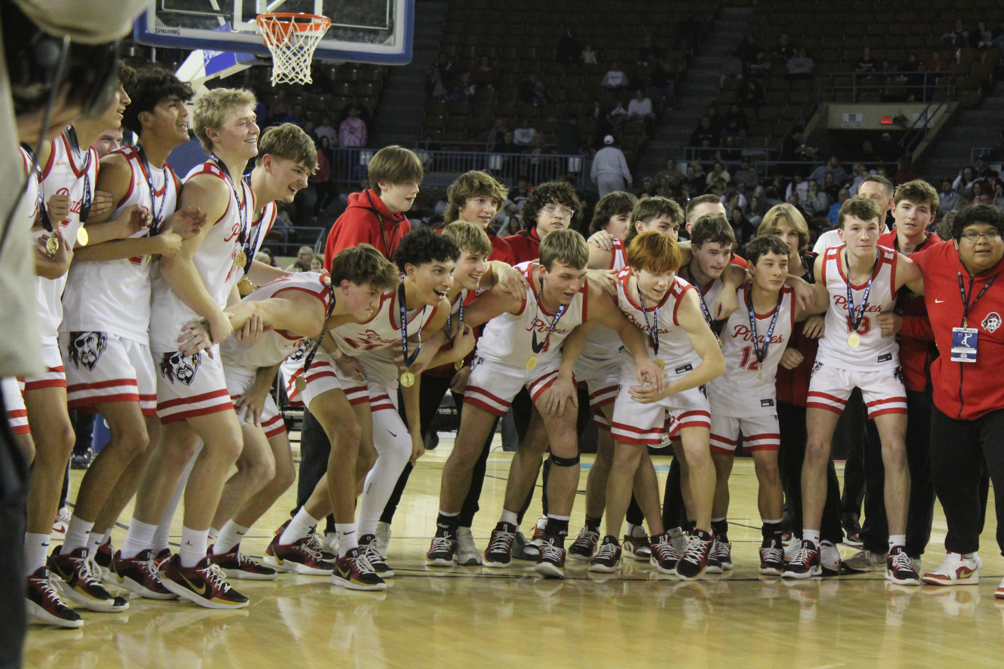 The Dale Pirates Basketball Team prepares to run up and claim the golden basketball trophy after winning the OSSAA Class 2A Basketball State Championship on March 8 at the State Fair Arena. The Pirates won against Cashion on March 6, 74-55; Fairland on March 7, 76-51; and, Pocola on March 8, 60-20, to take state for the fourth year straight. They end the season with a record of 30-2. Natasha Dunagan, Countywide & Sun 