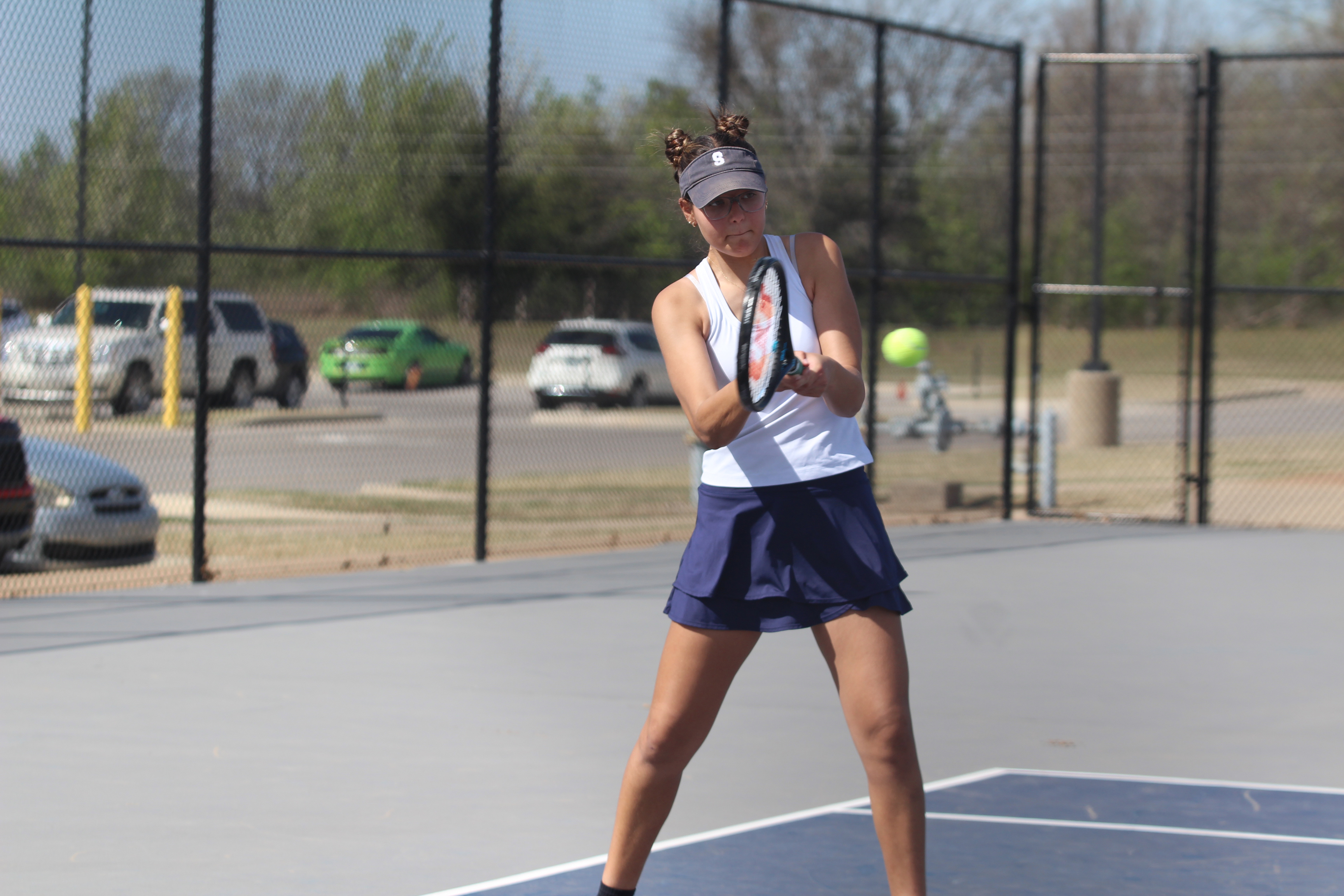 Shawnee freshman December Nanaeto keeps her eye on the ball in #2 Singles against Elgin during the East/West Quad Tournament on March 25. Nanaeto won her match, 7-6, 6-2. Natasha Dunagan, Countywide & Sun