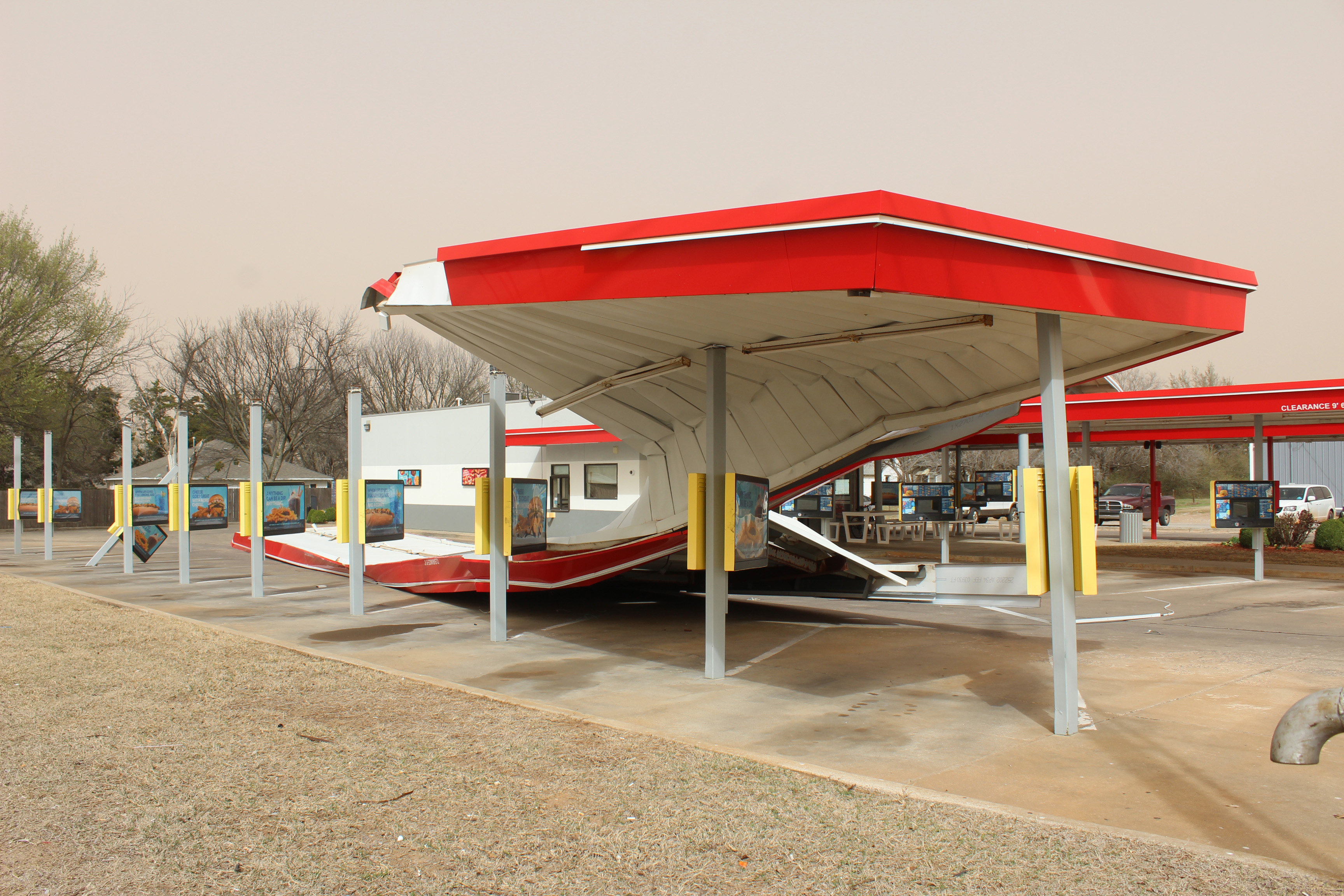 Strong winds on March 14 left the metal canopy over the western bank of stalls twisted and grounded at Sonic Drive-In, 109 E. Walnut, in Tecumseh. Franchise co-owner Brett Blair said they were paying attention when the canopy began to tilt from side to side, and they called the police who blocked off that side of the business, so no one was hurt when it collapsed. Blair said the electricity went out, and computers were offline before it happened. They have since reopened. Natasha Dunagan, Countywide & Sun