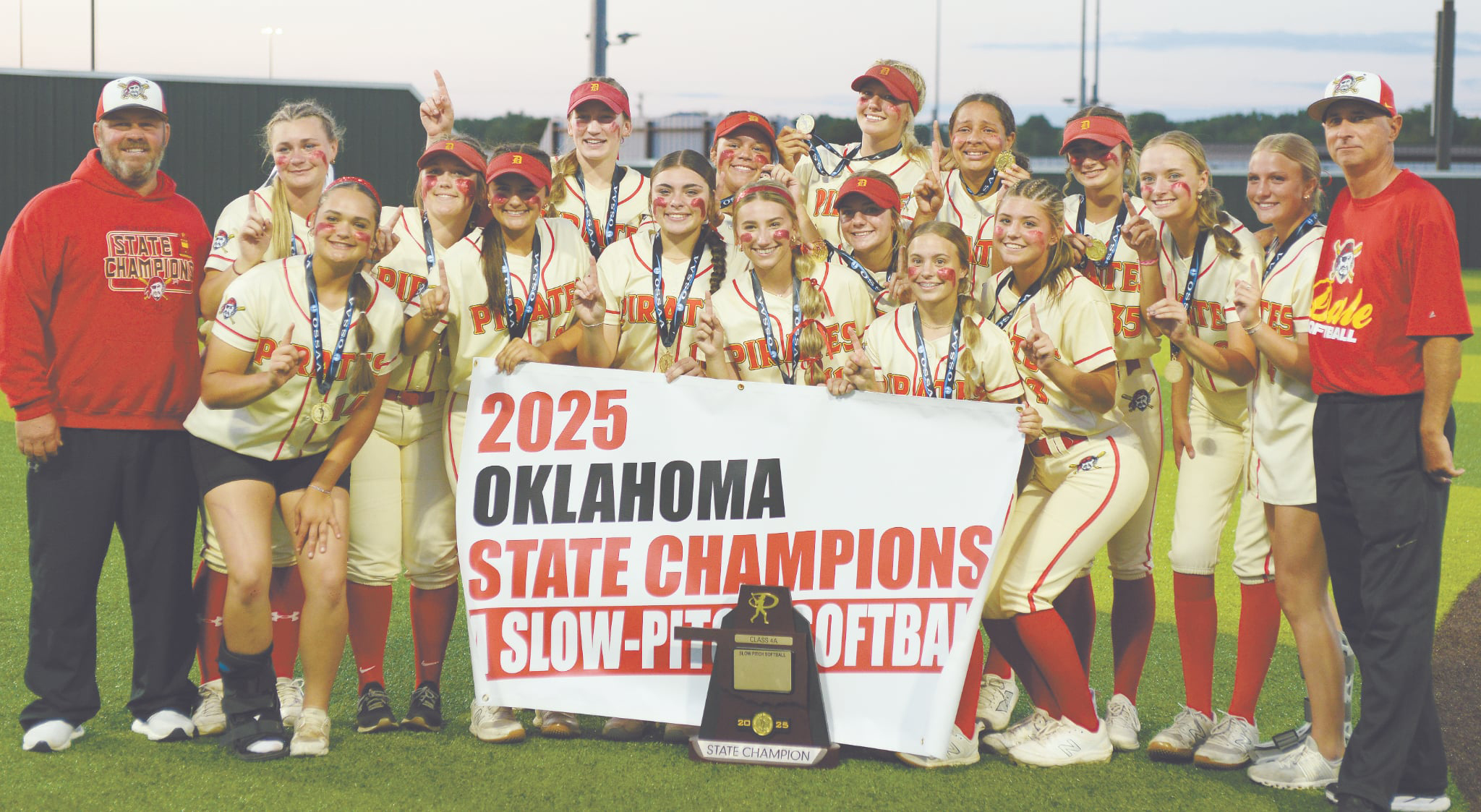 The Dale Lady Pirates Slow Pitch Team poses with Assistant Coach Eric Muncy, far left, and Head Coach Andy Powell, far right,  after winning the Class 4A State Championship at FireLake Ball Fields on May 8. They won all three games - with Calera, 12-1; Haskell, 4-1; and, Pocola, 11-10. Photo courtesy of Brian Blancett, Lincoln County News