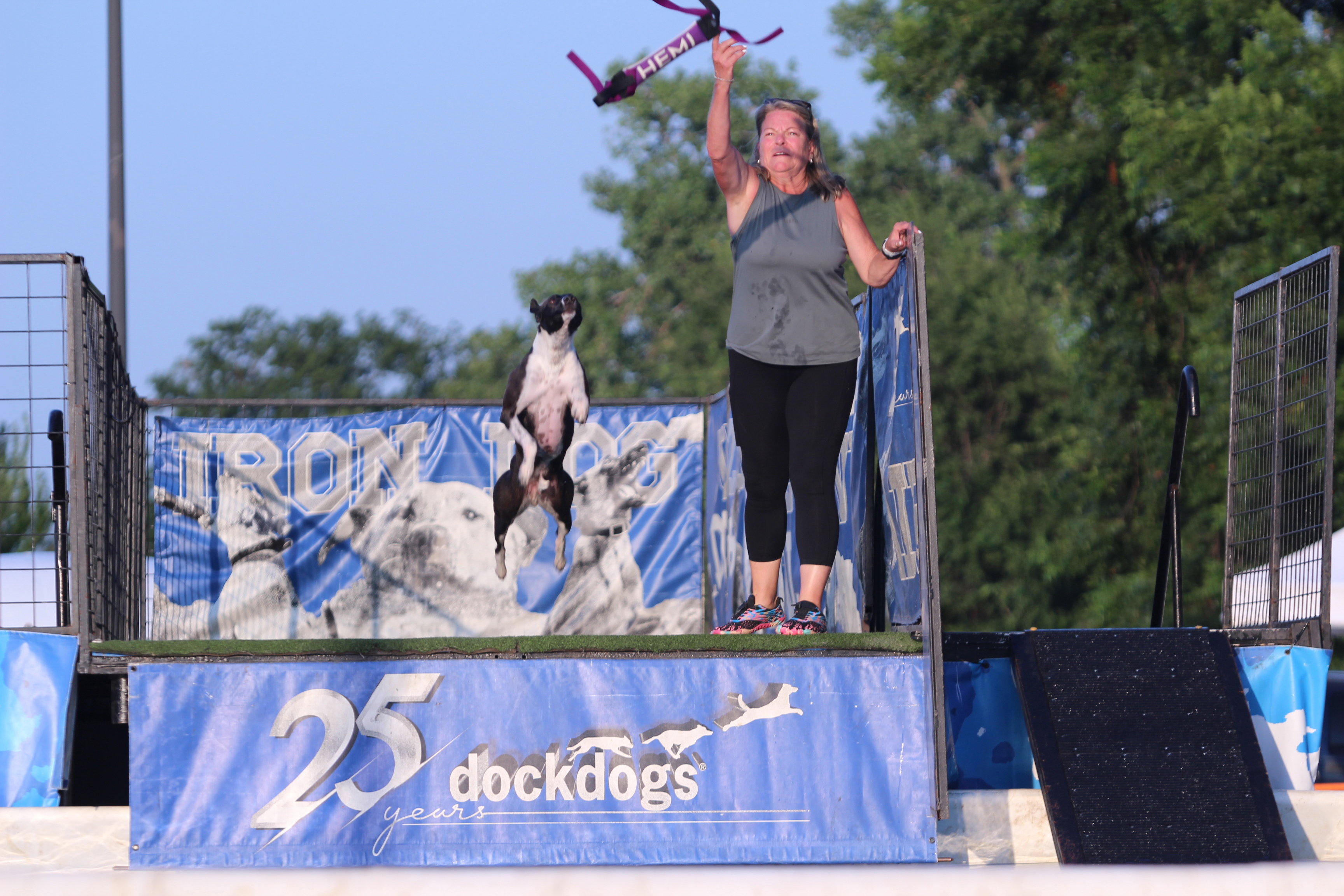 Helena Cudd throws a toy for Hemi during the DockDogs® competition at the FireLake Fireflight Balloon Festival on Aug. 9. Hemi won first in the Pro Finals with a 25-foot, seven-inch jump. This is the first year for the competition, which attracted contestants from all over Oklahoma and Texas.