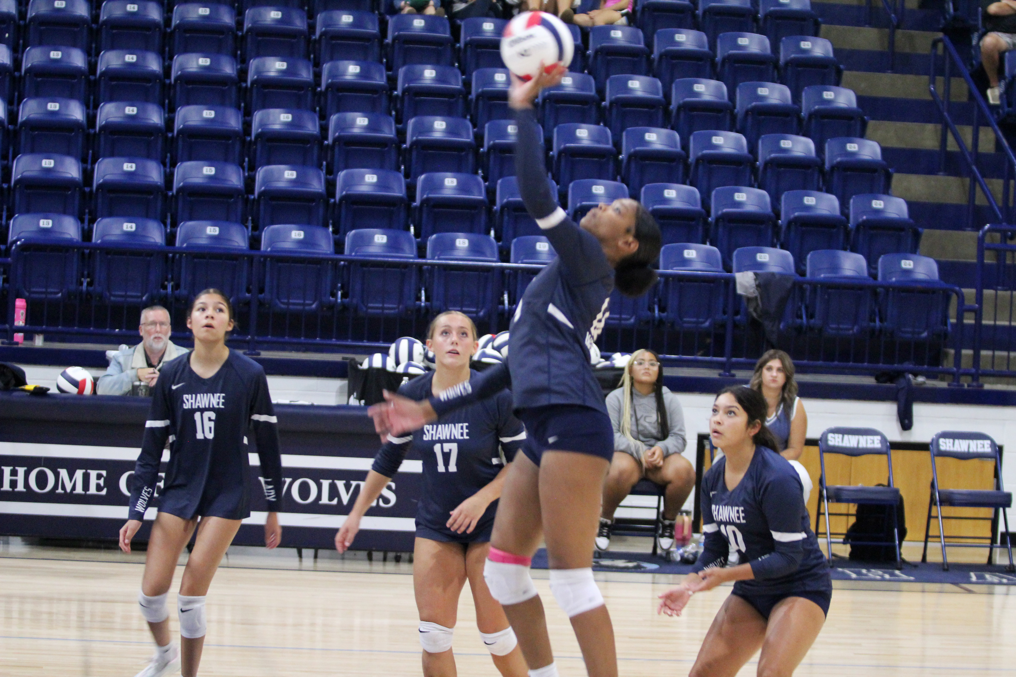 Shawnee junior JaNya Bruner keeps the ball in play during the home game with Del City on Aug. 28. Also shown are Ava Plumley, Molly Megehee and Khloe Smith. The Lady Wolves won, 3-0. Their scores were 25-20, 25-18 and 25-11.