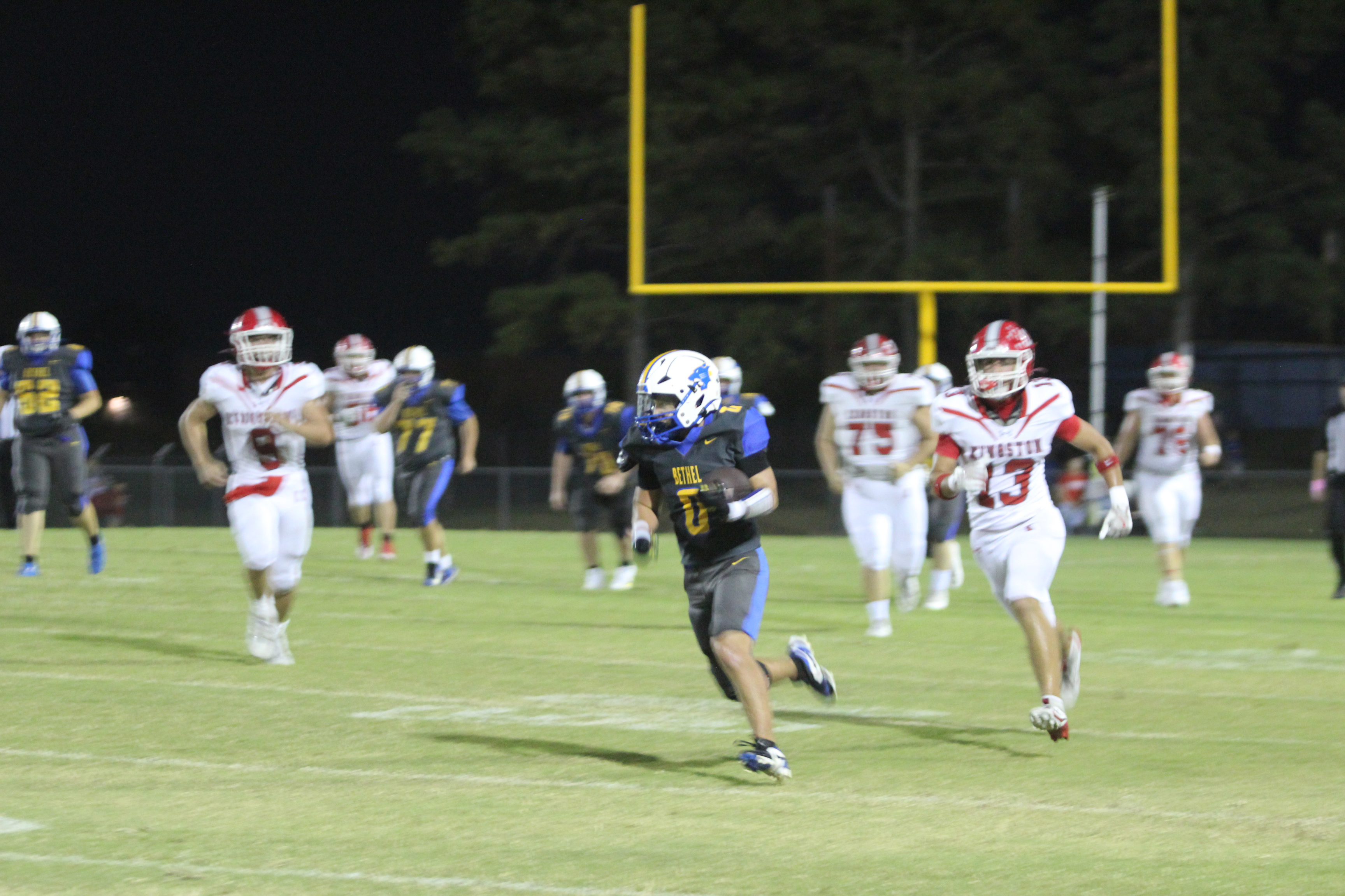 Bethel senior Leighton Swegheimer carries the ball for a first down and 10 during the Military Night home game against Kingston on Oct. 10. File photo
