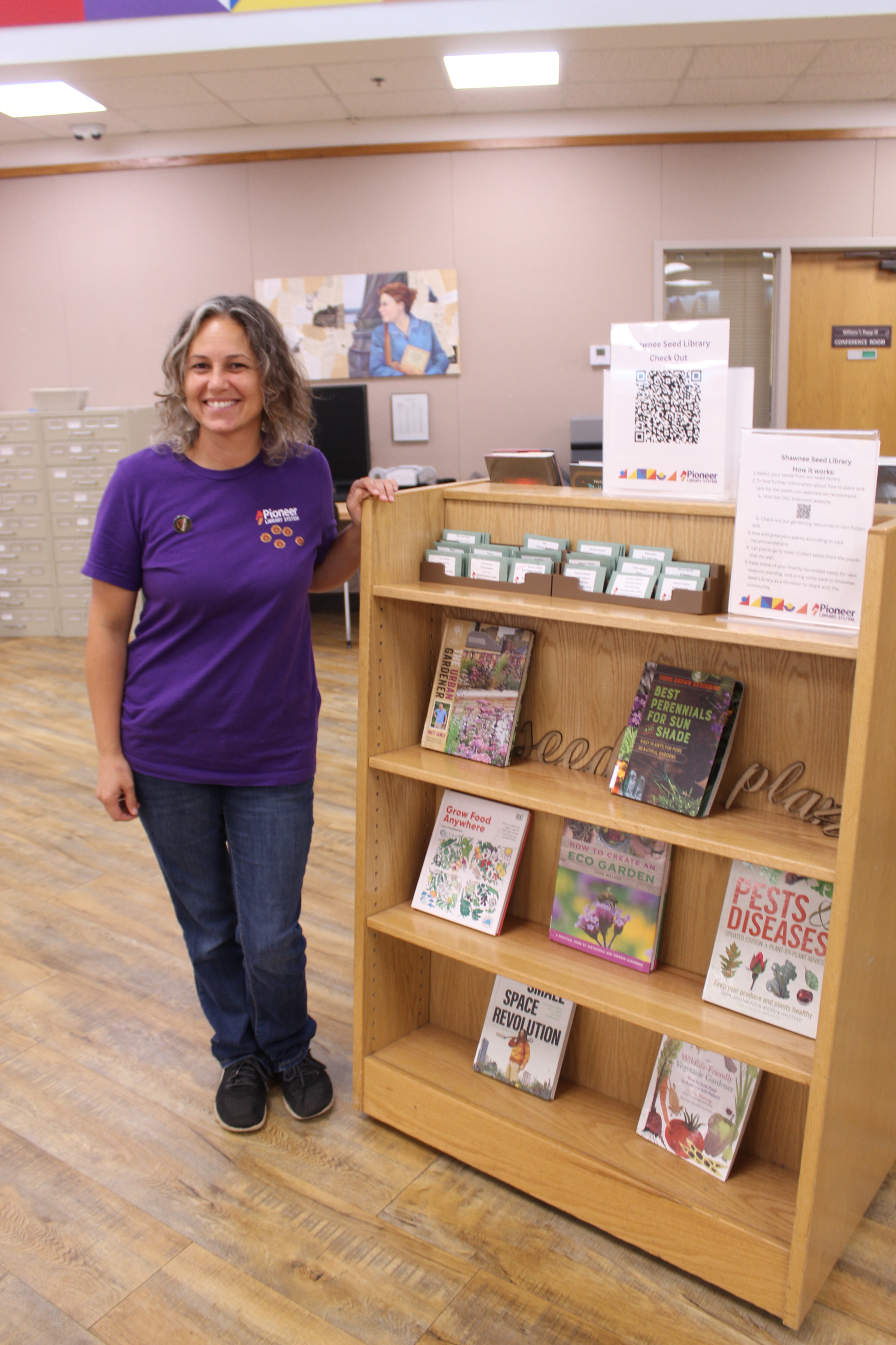Shawnee Public Library Associate Jessica Perkins stands by their new Seed Library. Natasha Dunagan, Countywide & Sun