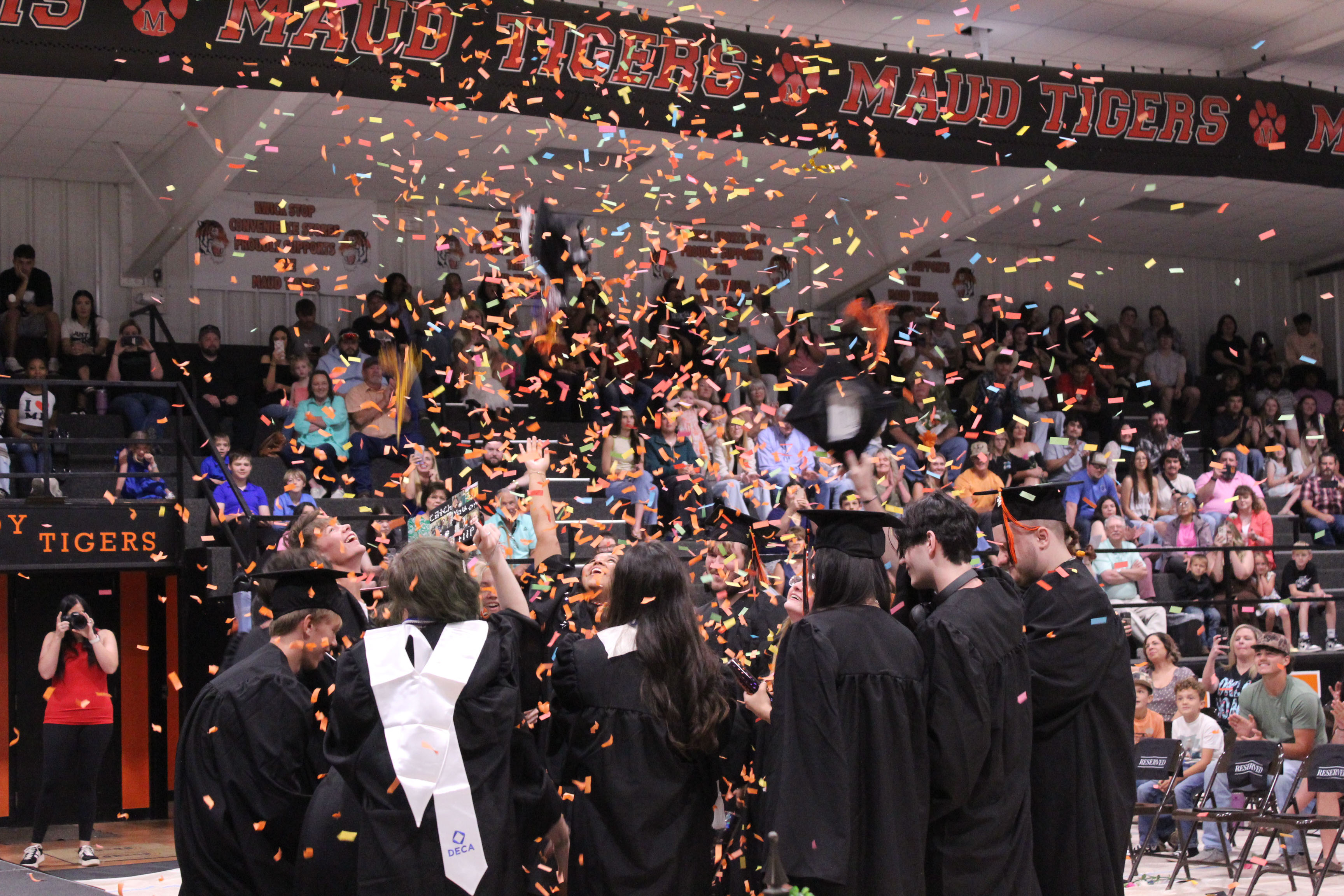 The Maud High School Class of 2026 celebrates graduating with confetti canons and tossed caps on May 22 at the Ed Harman Gymnasium. Maud graduated 20 seniors.