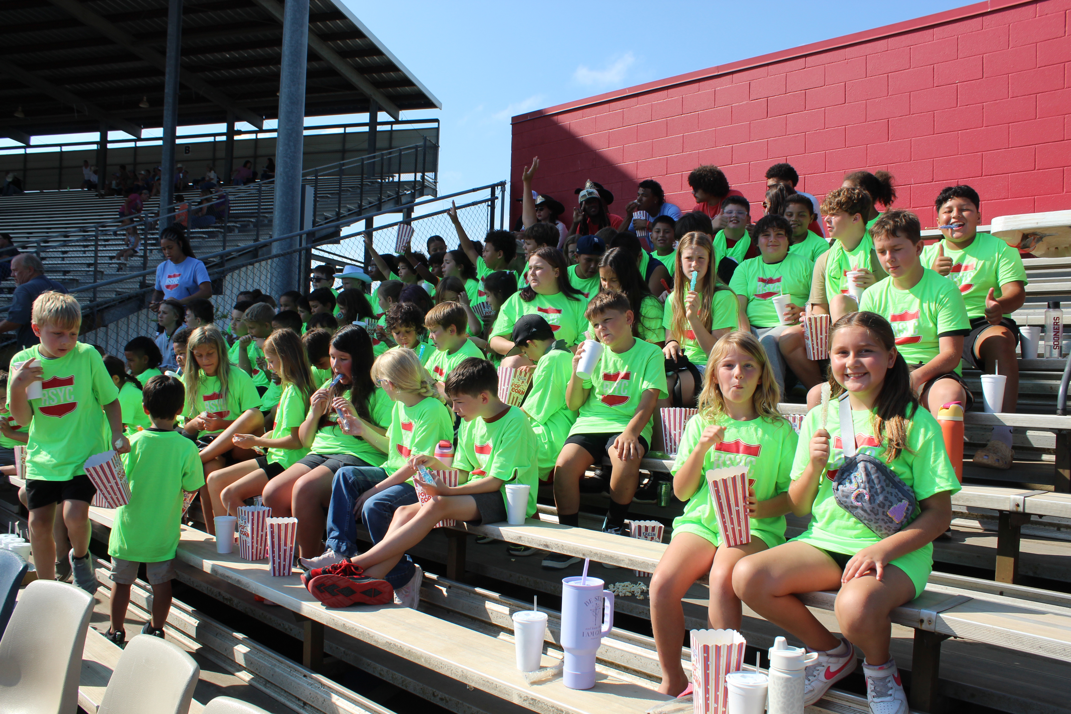 Sixty-seven Red Shield Youth Summer Campers, from Salvation Army's Boys & Girls Club, were the guests of the International Finals Youth Rodeo on the morning of July 14. They sat in the VIP section and received popcorn, drinks and rock candy. Salvation Army Captain Thomas Marion said the camp is for those ages 6 to 17 and runs from June 1 - July 30. See full caption below.