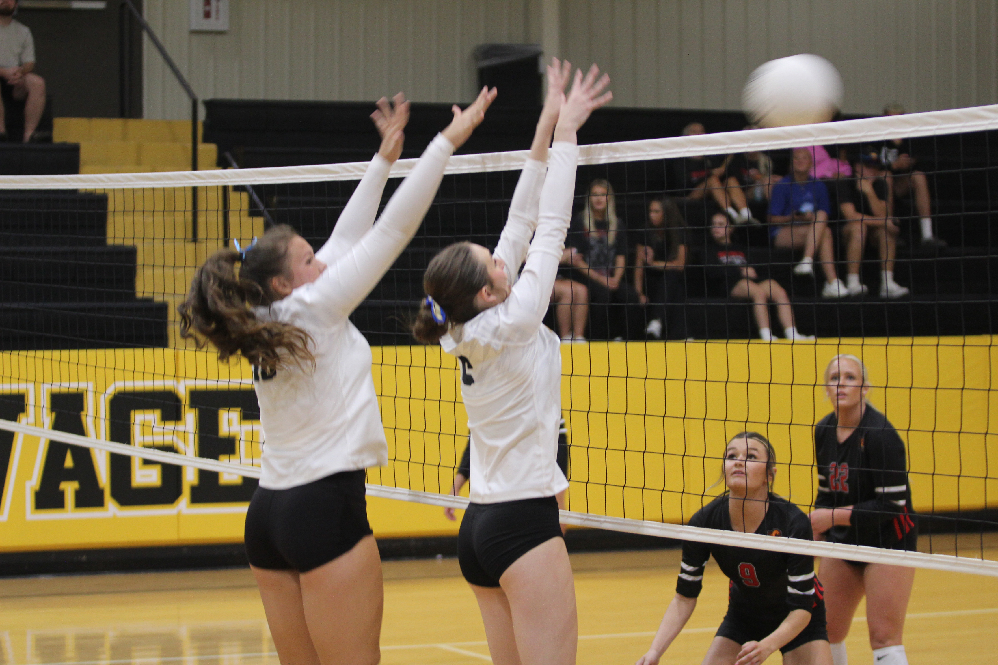 Tecumseh sophomores Aivah Dodgion and Kenda Whittington block the ball in the home match against North Rock Creek on Aug. 28, 2025. File photo