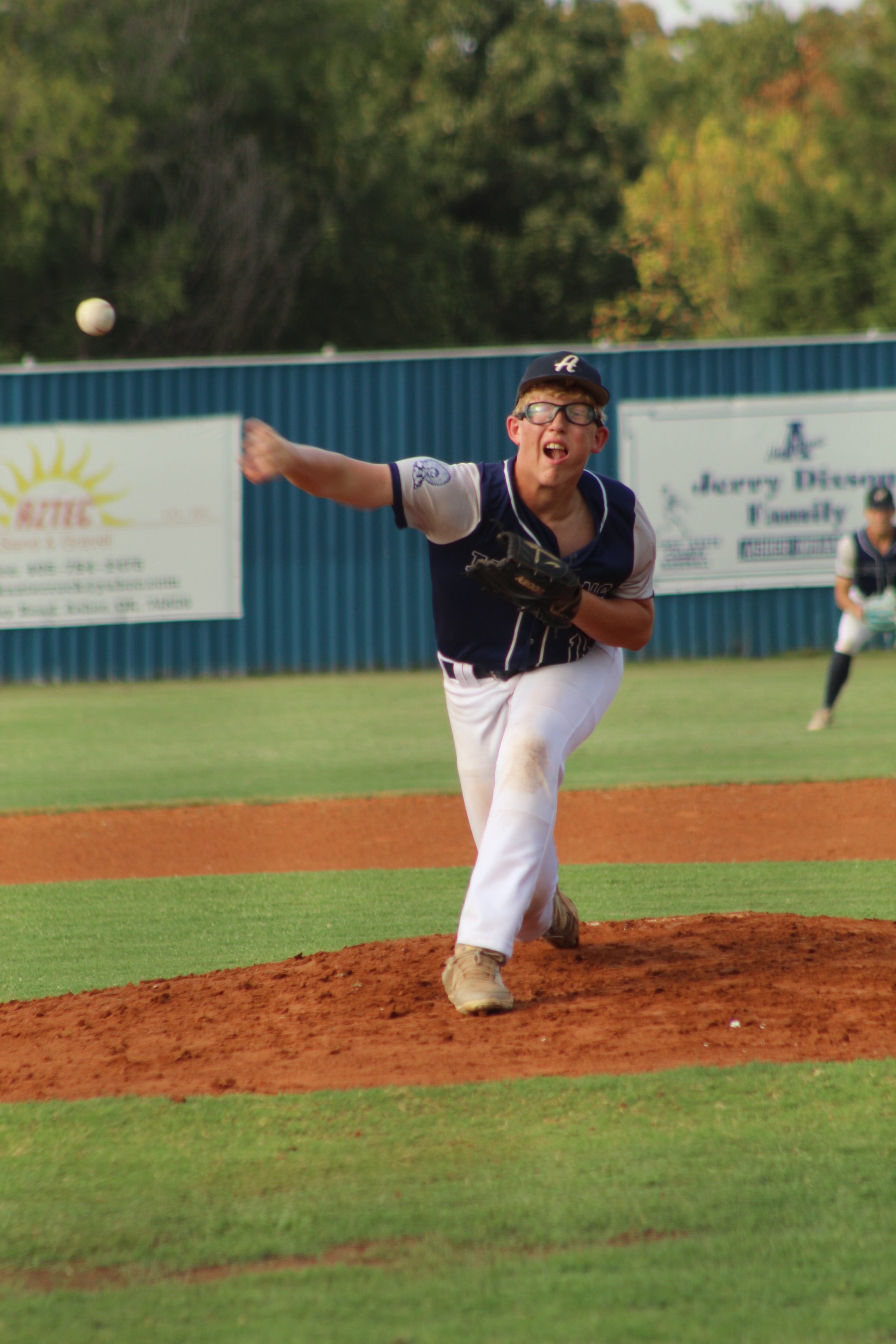 Asher sophomore Blake Francis puts a twist on his pitch during the second inning of the Aug. 25 home game against Kiowa. 