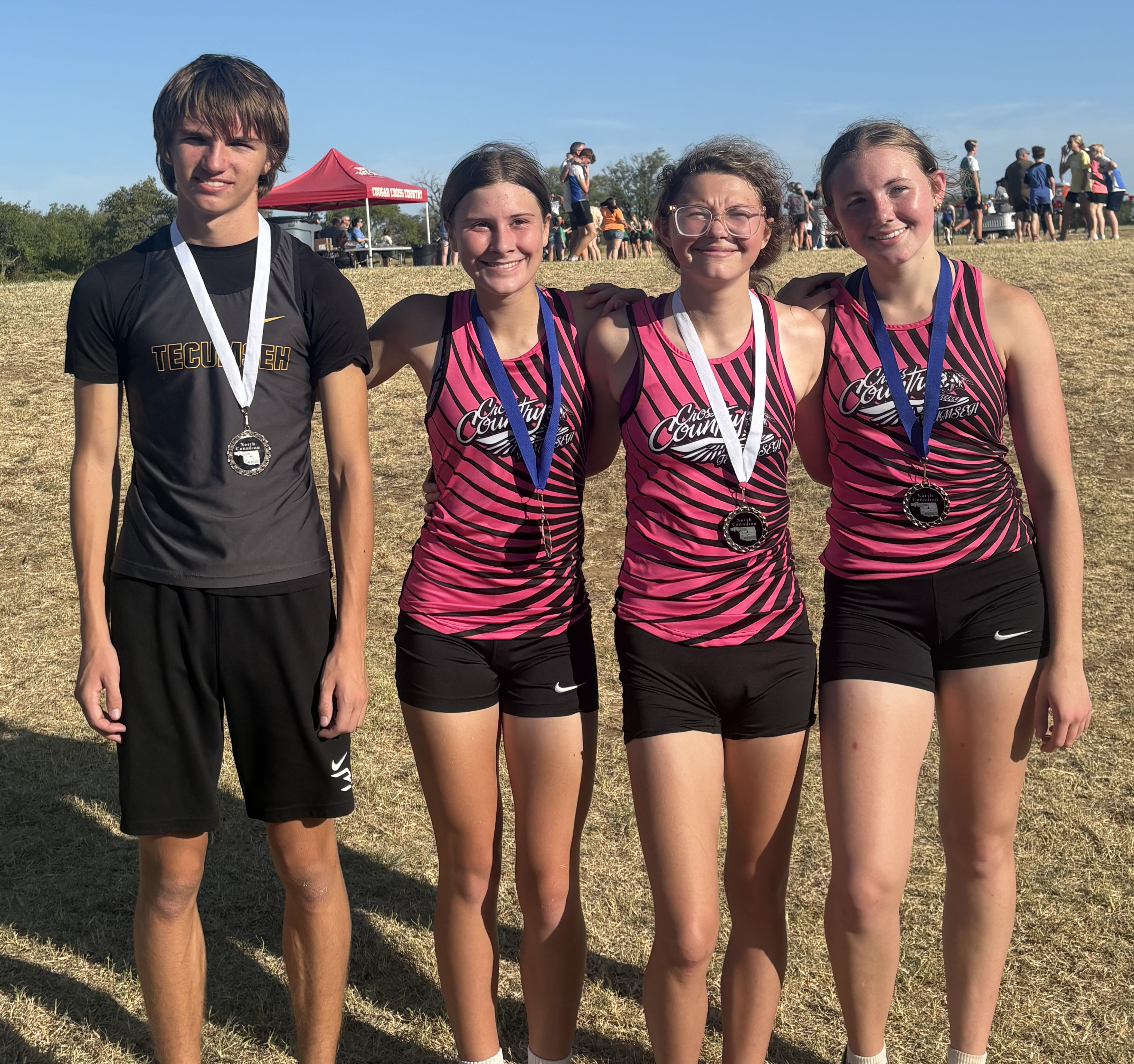 Tecumseh Cross Country competed at the North Rock Creek Conference Cross Country Meet on Sept. 12. Shown from left are Brody Tench, who placed 14th; Sosi Mitchell, 5th place; Kate Pearcy, 15th place; and Allison Walker, 3rd place. Photo provided by Tecumseh Public Schools