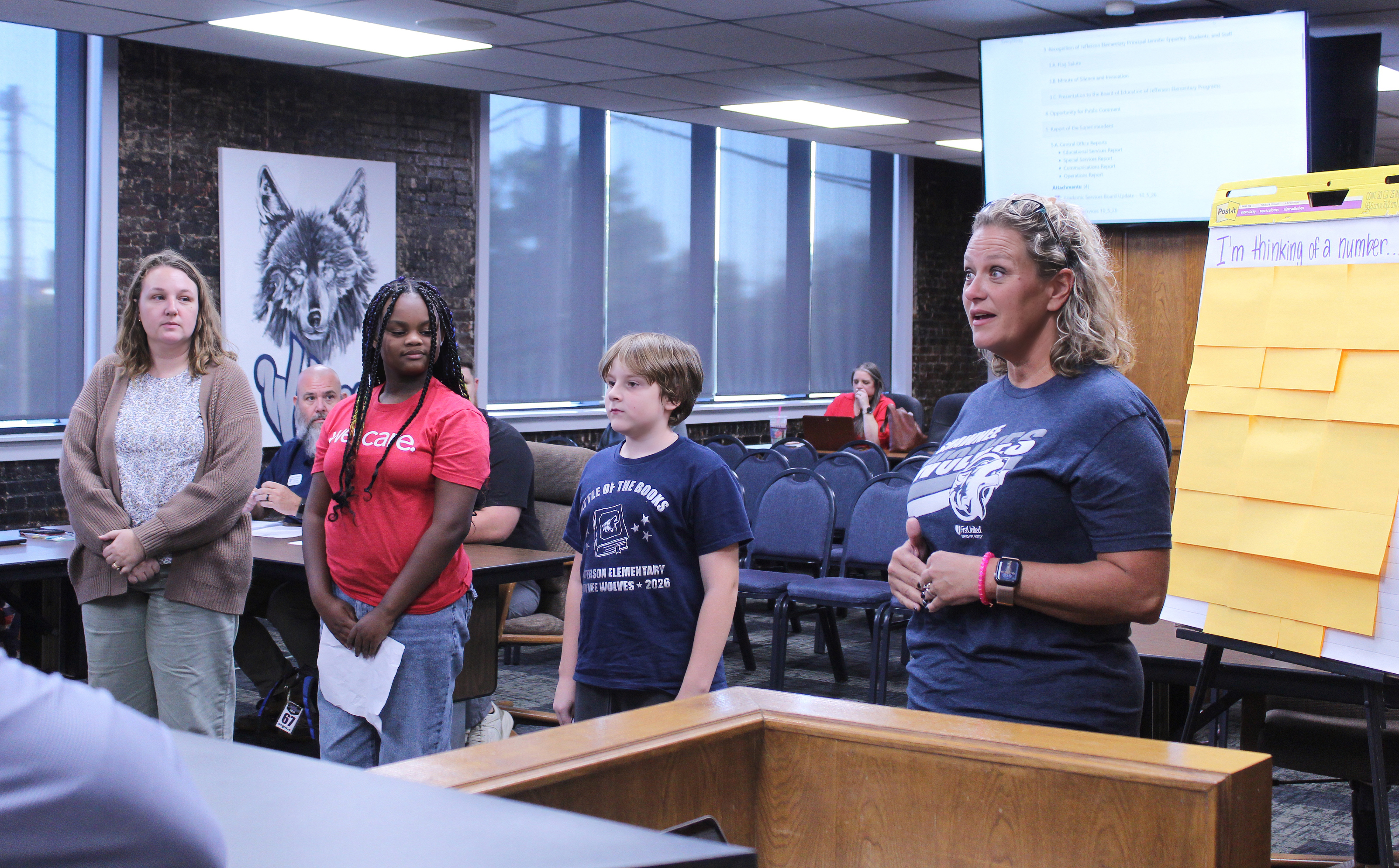 Jefferson Elementary Principal Jennifer Epperley speaks with the Shawnee Board of Education during the Oct. 5 meeting, as Instructional Coach Katelyn Miears , Nedra Edwards and Isaiah Peters look on. They led the flag salutes and invocation and also led the Board in a math-based game of "I'm Thinking of a Number." Photos by Natasha Dunagan, Countywide & Sun