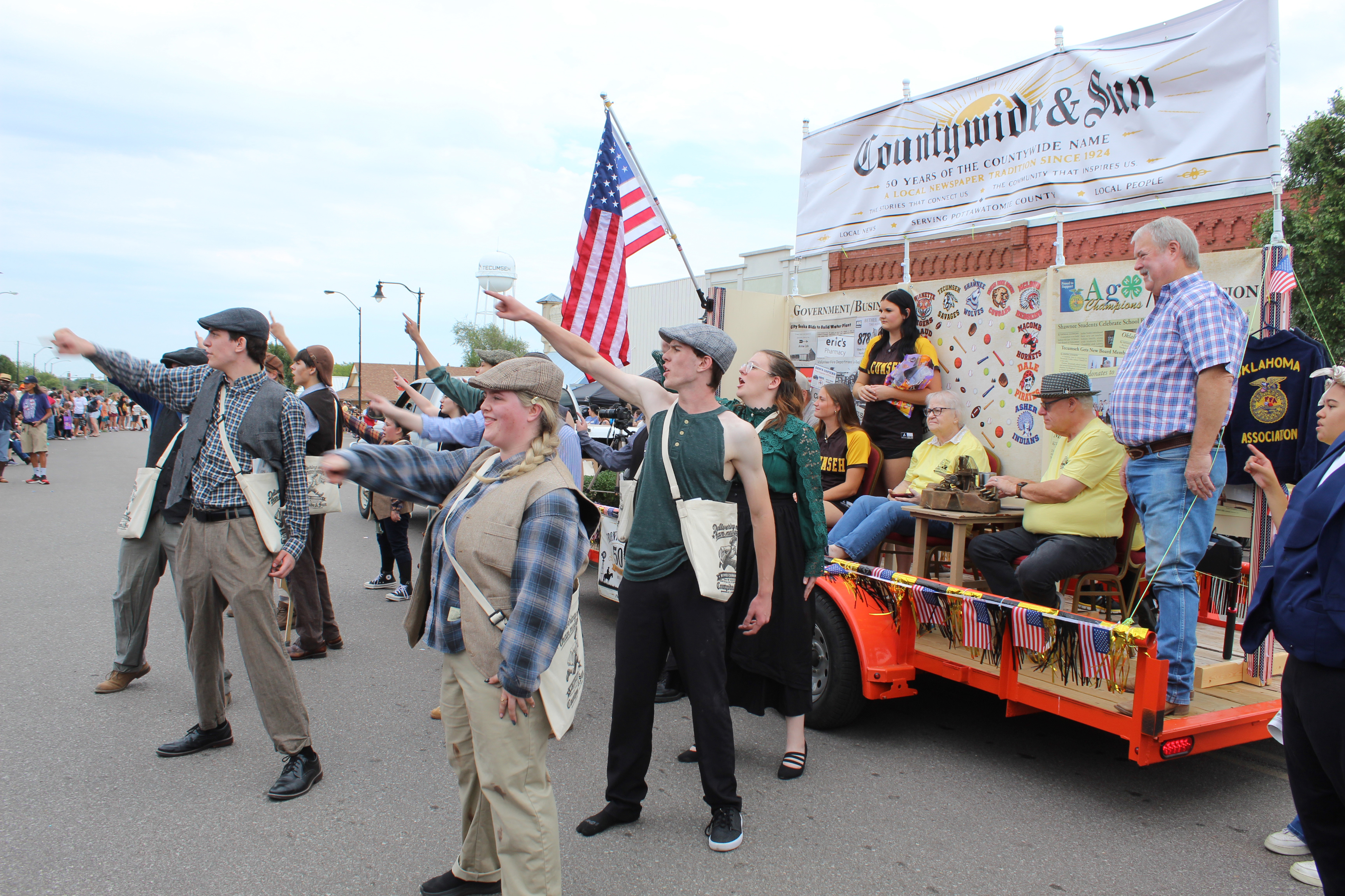 The North Rock Creek drama "Newsies" perform "The World Will Know" from their spring play for the Frontier Days Parade judges, as part of the Countywide & Sun's 50th anniversary float. Natasha Dunagan, Countywide & Sun