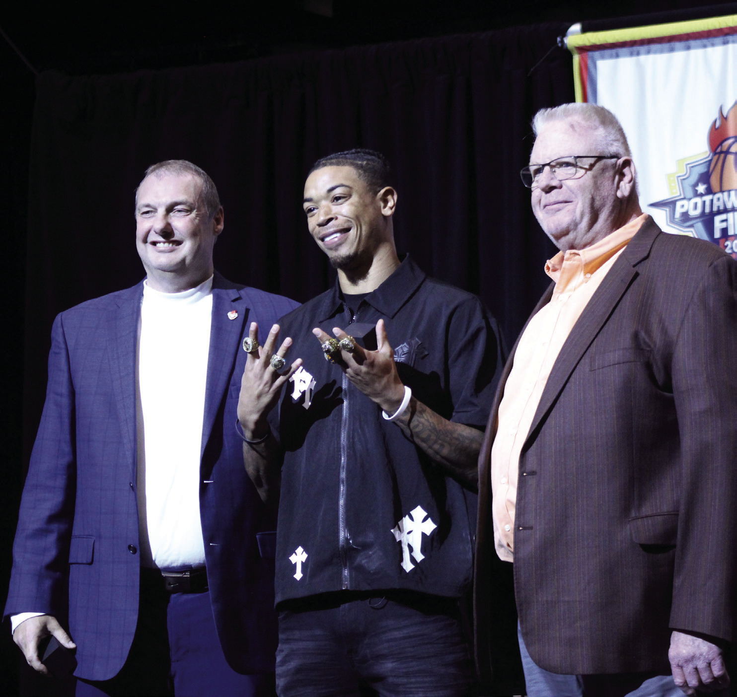 Potawatomi Fire Guard Chuck Guy accepts another ring as two-time TBL MVP during the Third Annual 2025 TBL Championship Banquet and Ring Ceremony at FireLake Arena on Feb. 19. Also shown are, left, Head Coach Mark Dannhoff and, right, FireLake Arena General Manager David Qualls. Natasha Dunagan, Countywide & Sun